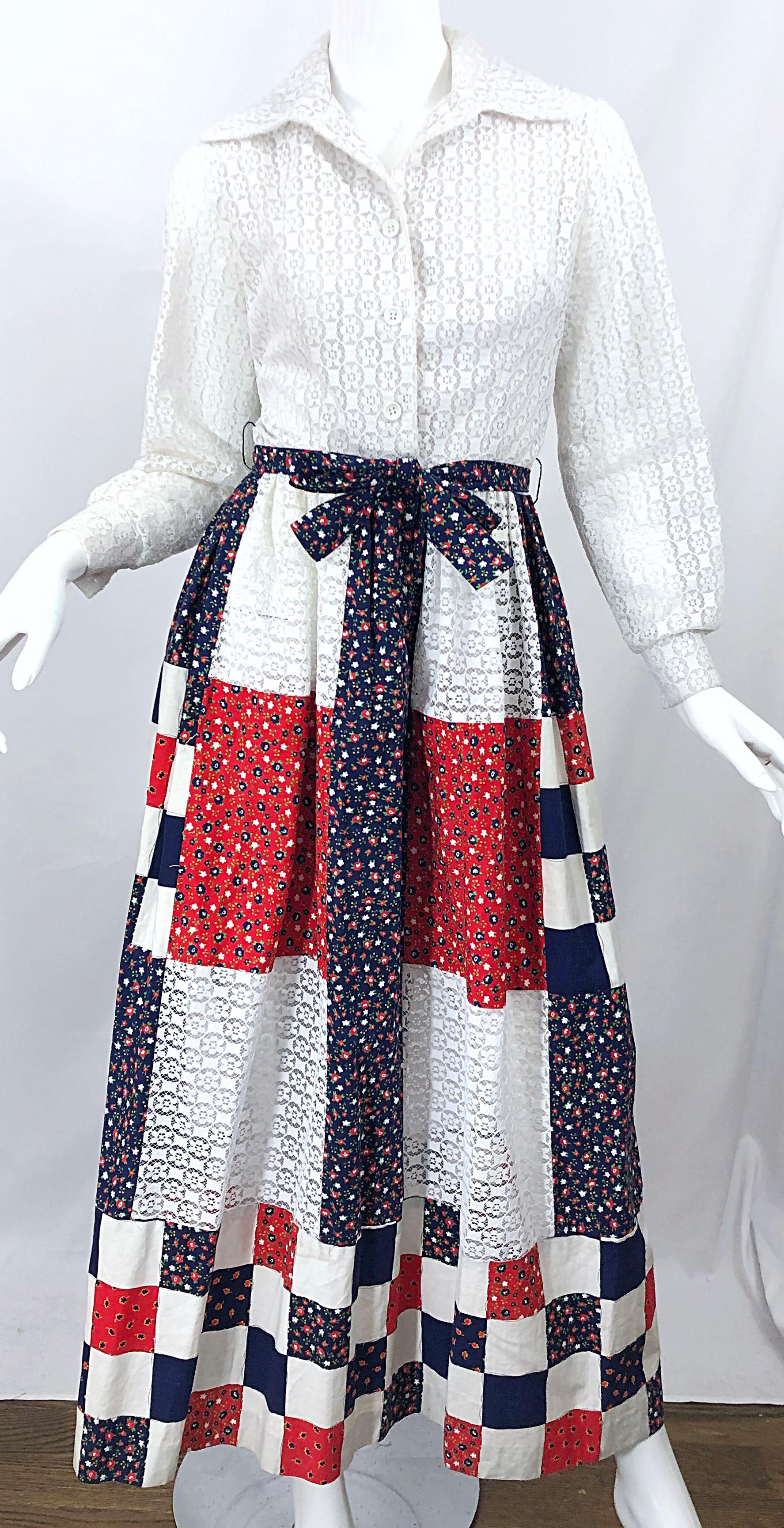 Stylish vintage 70s red, white and blue patchwork cotton and eyelet lace long sleeve maxi dress! Features a solid white eyelet lace in shapes of flowers. Buttons up the front and at each sleeve cuff. Skirt has a detachable bet in the same fabric as