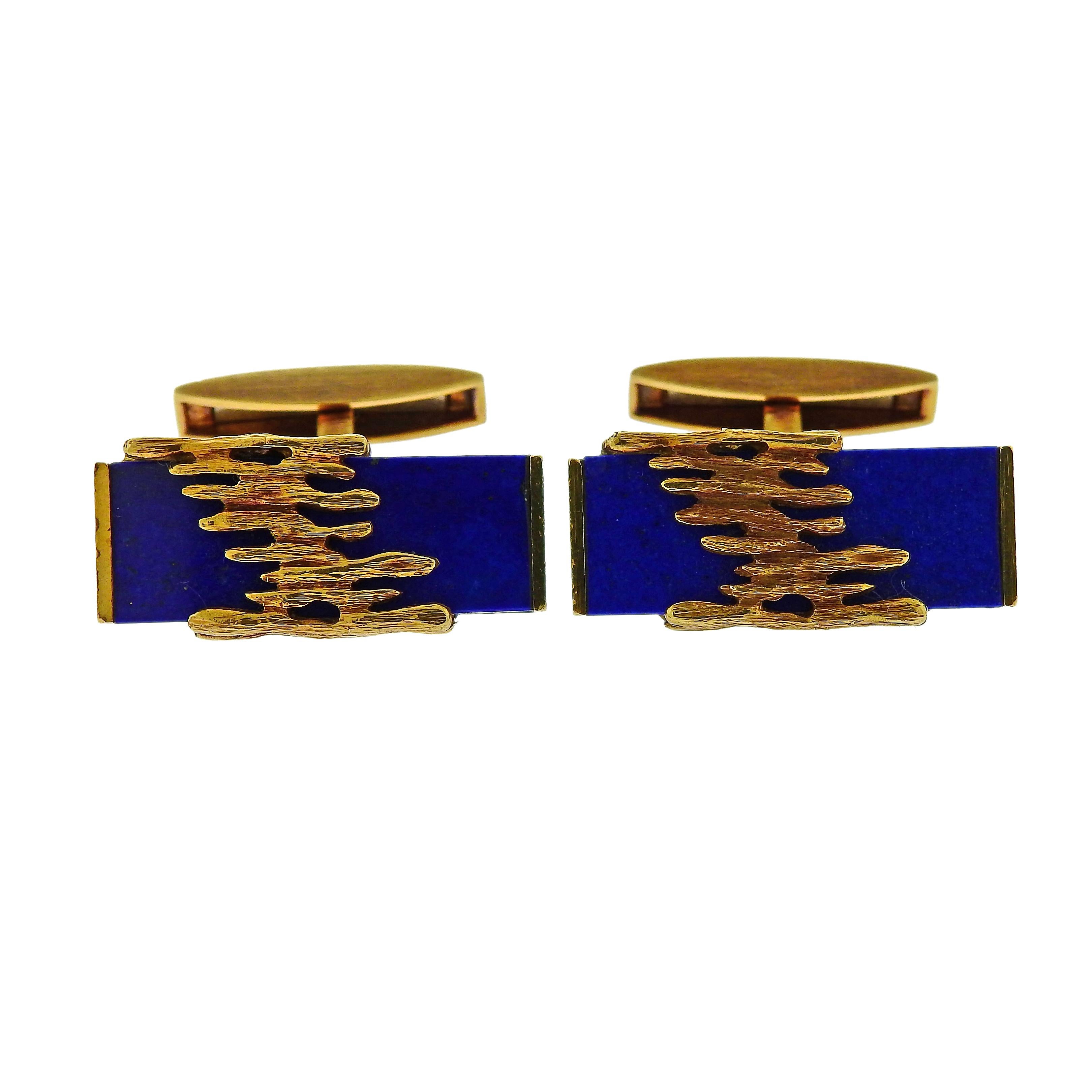 Pair of 18k yellow gold circa 1970s cufflinks, designed by Patek Philippe, set with lapis lazuli. Cufflink top - 26mm x 12mm. Weight is 23.9 grams. Marked 9001, 160, Patek Philippe, 750, Geneve.
