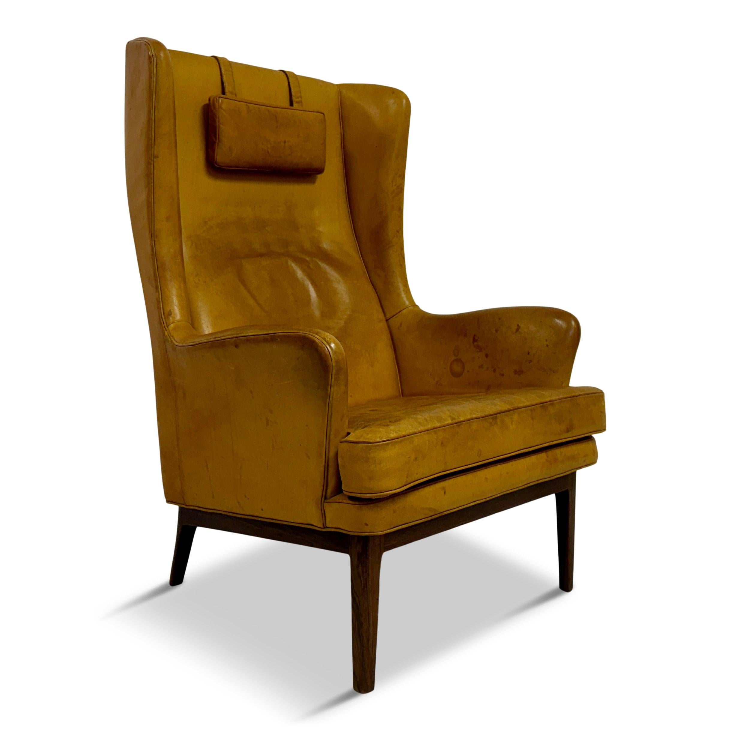 Armchair

Patinated leather

Wingback

Removable weighted head rest

Wood frame

Seat height 42cm

Sweden 1960s