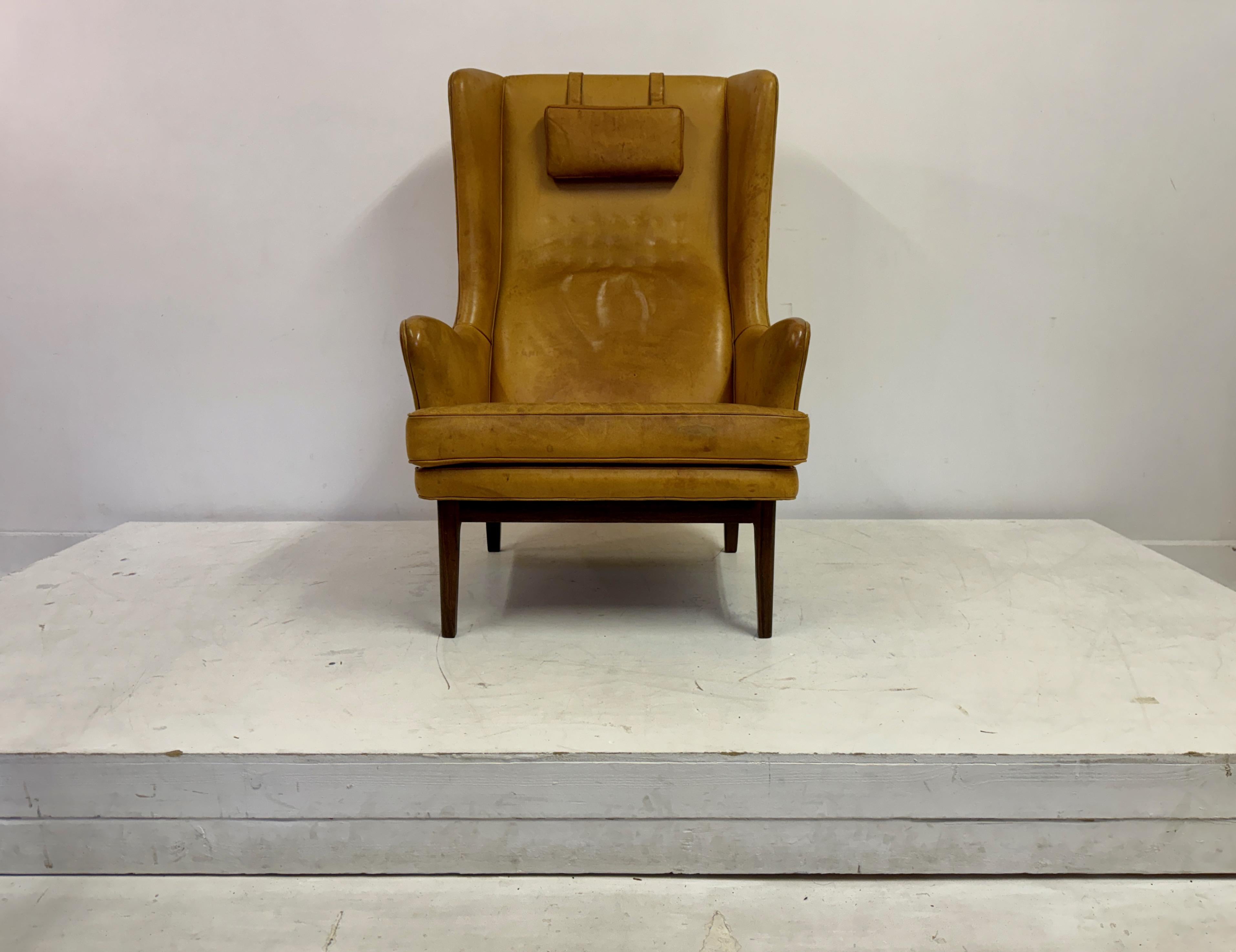 Swedish 1970s Patinated Leather Wingback Krister Armchair by Arne Norell For Sale