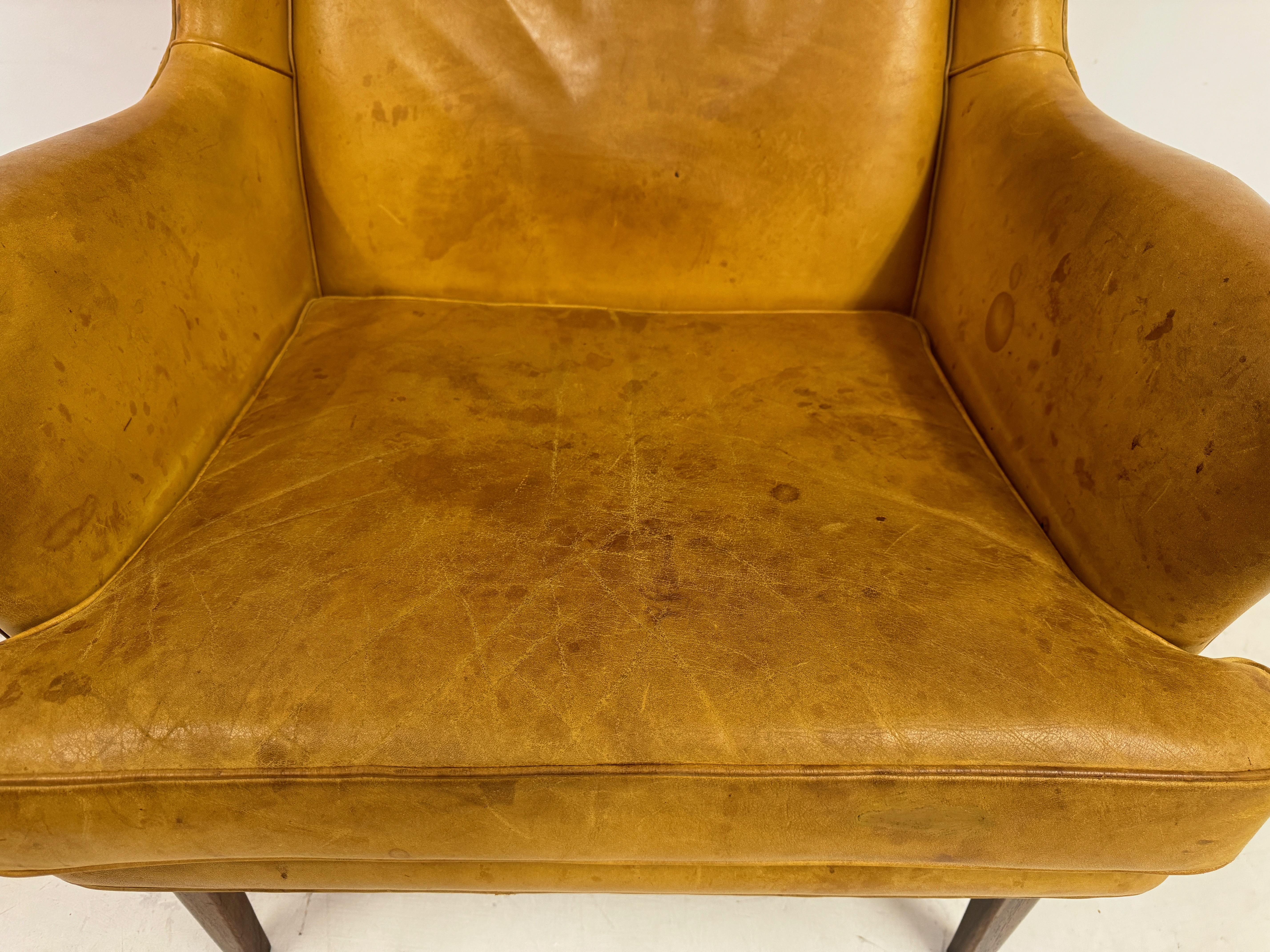 20th Century 1970s Patinated Leather Wingback Krister Armchair by Arne Norell For Sale
