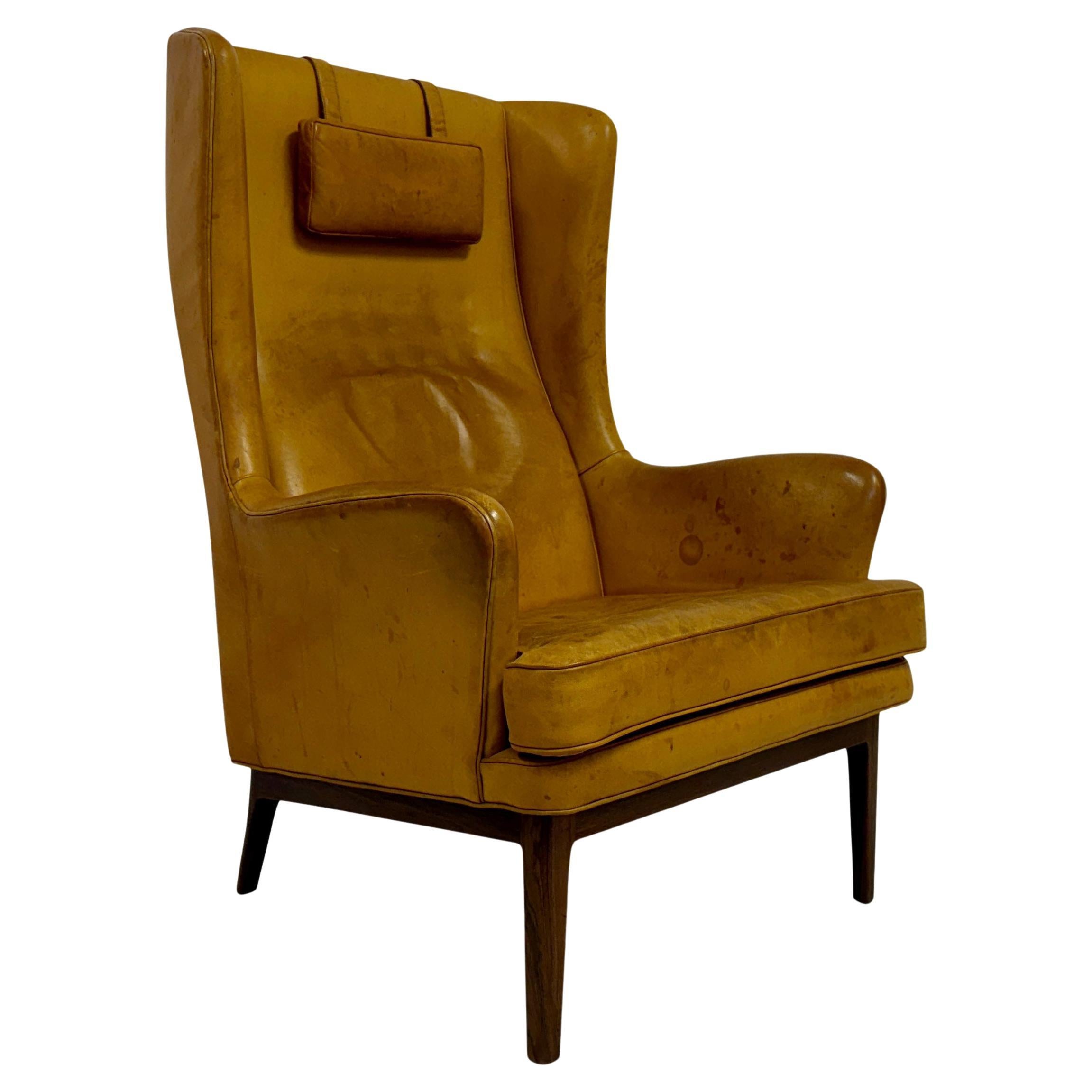 1970s Patinated Leather Wingback Krister Armchair by Arne Norell For Sale