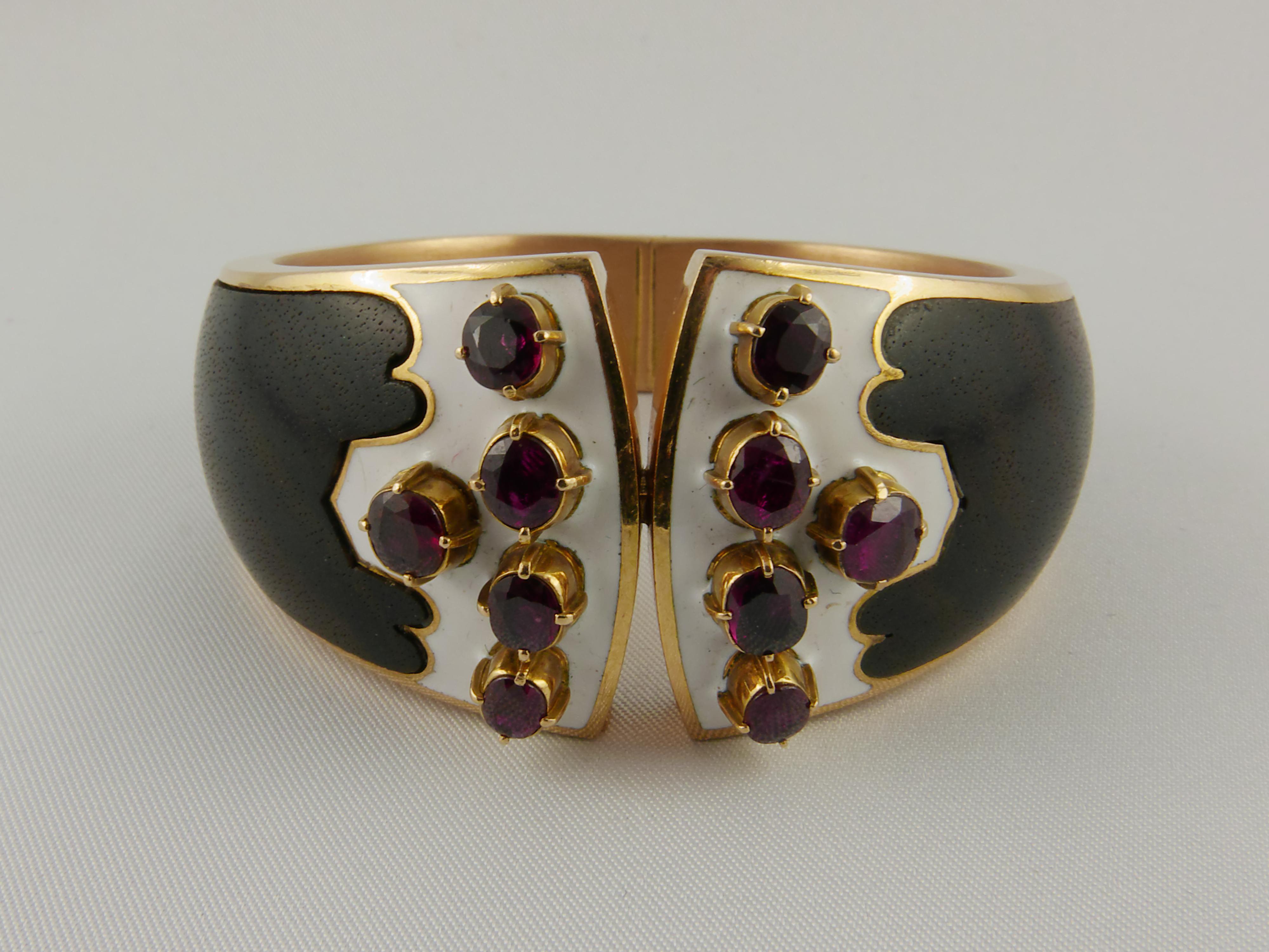 Glamourous 1970S Paul Binder Wood and Enamel cuff bracelet, accented by 2.50 cts approx oval-shaped Rubies  set in 18k Yellow Gold mounts. This unconventional, eye-catching bracelet is comfortably wearable for all occasions. Paul Binder opened his