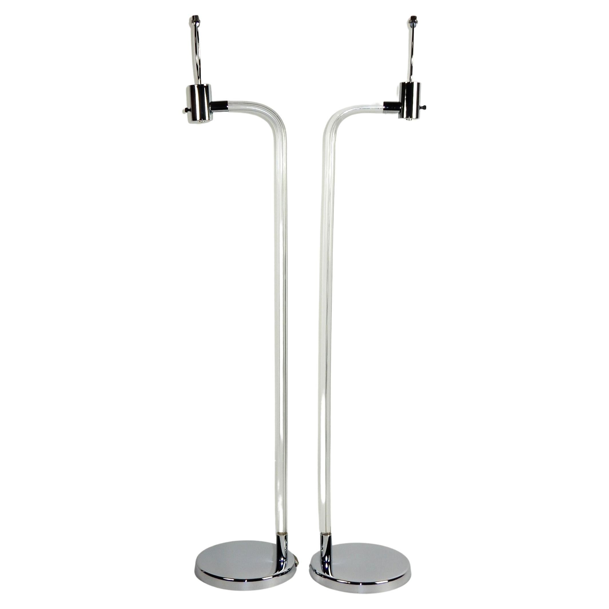 Here is an exceptionally well cared for pair of Lucite and chrome floor reading lamps.
designed by Peter Hamburger for Knoll, 1970's.
Large gleaming chrome steel disc base supporting a 1 inch thick Lucite rod with 