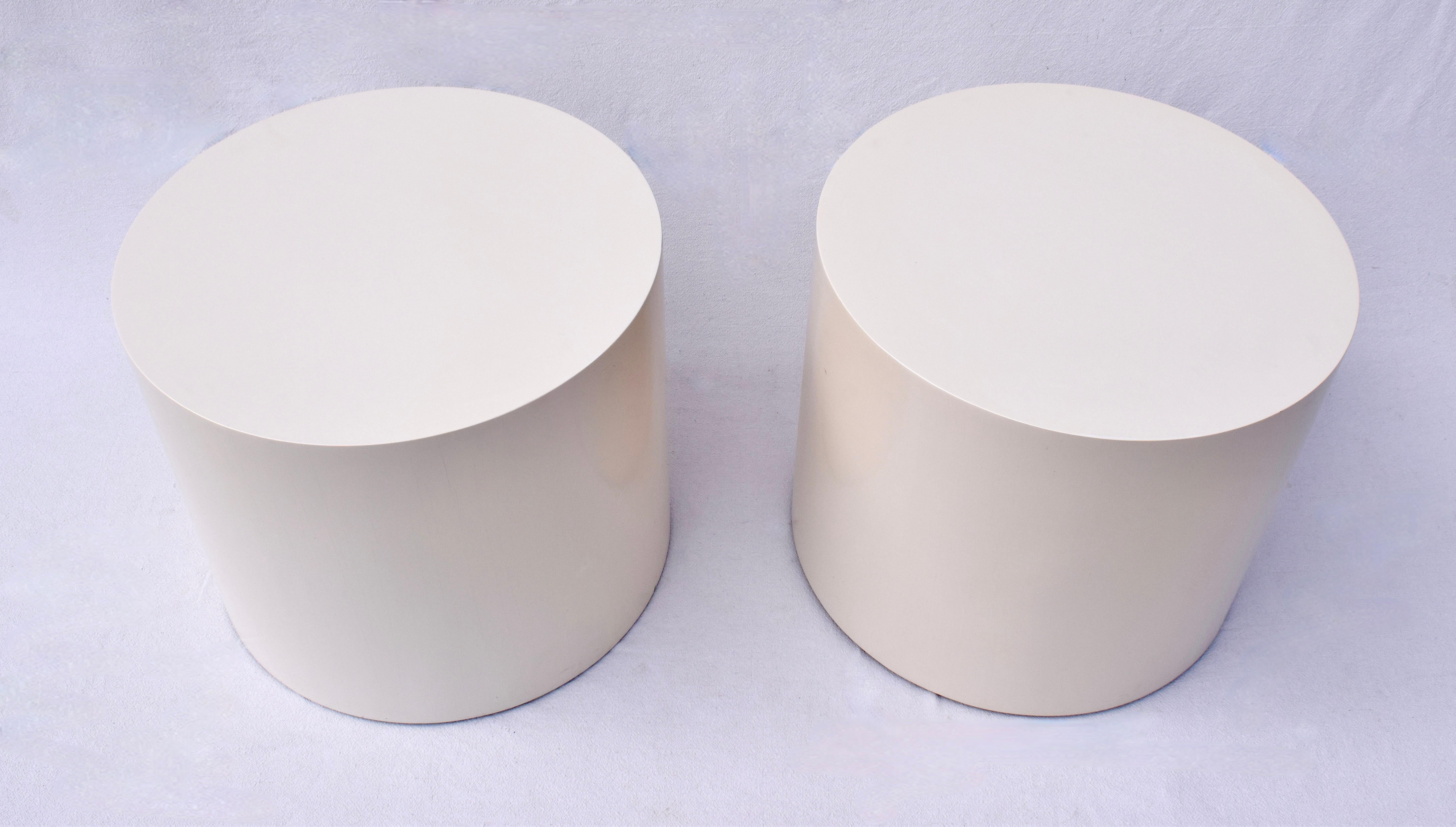 A pair of 1970's wood drum tables with original almond lacquer and adjustable risers. Generous proportions of 26' round x 22