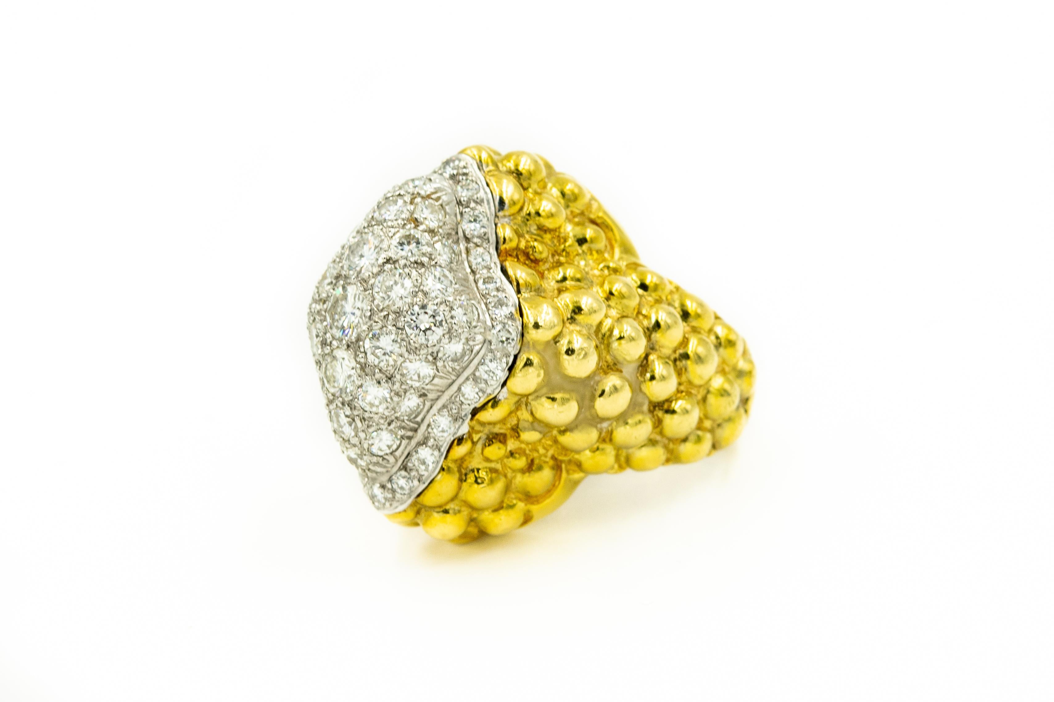 Impressive 1970s David Webb style cocktail ring  featuring a marquis shaped raised pave diamond center on a highly stylized beaded, pebbled or bubble designed 14k yellow gold band. The ring contains approximately 4.02 carats of diamonds.

US size