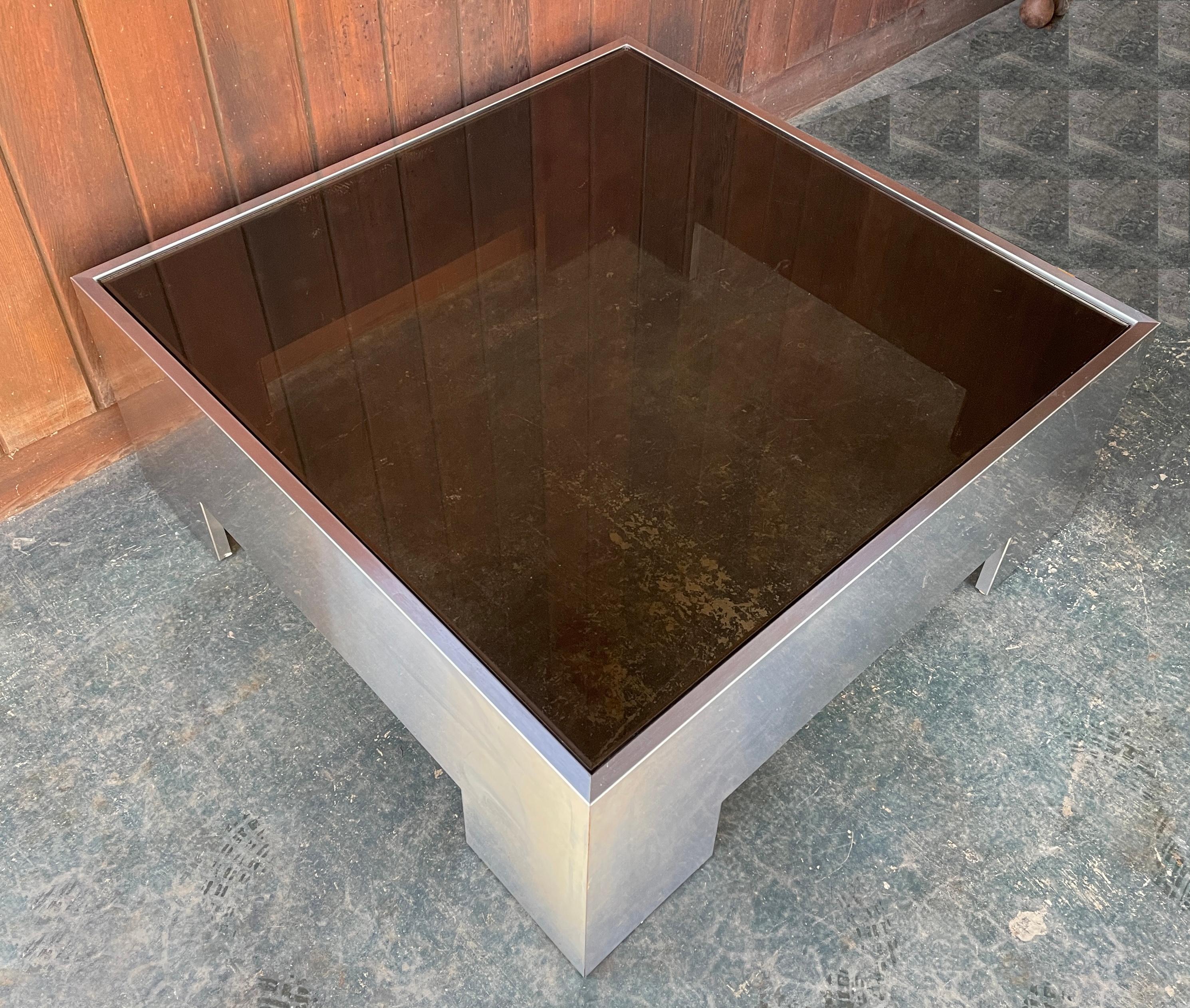 No chips to glass, but scratches to top surfaces from normal uses. No makers markings. Plywood core wrapped in stainless steel.

Measures: W 38 x D 38 x H 15.25 in.