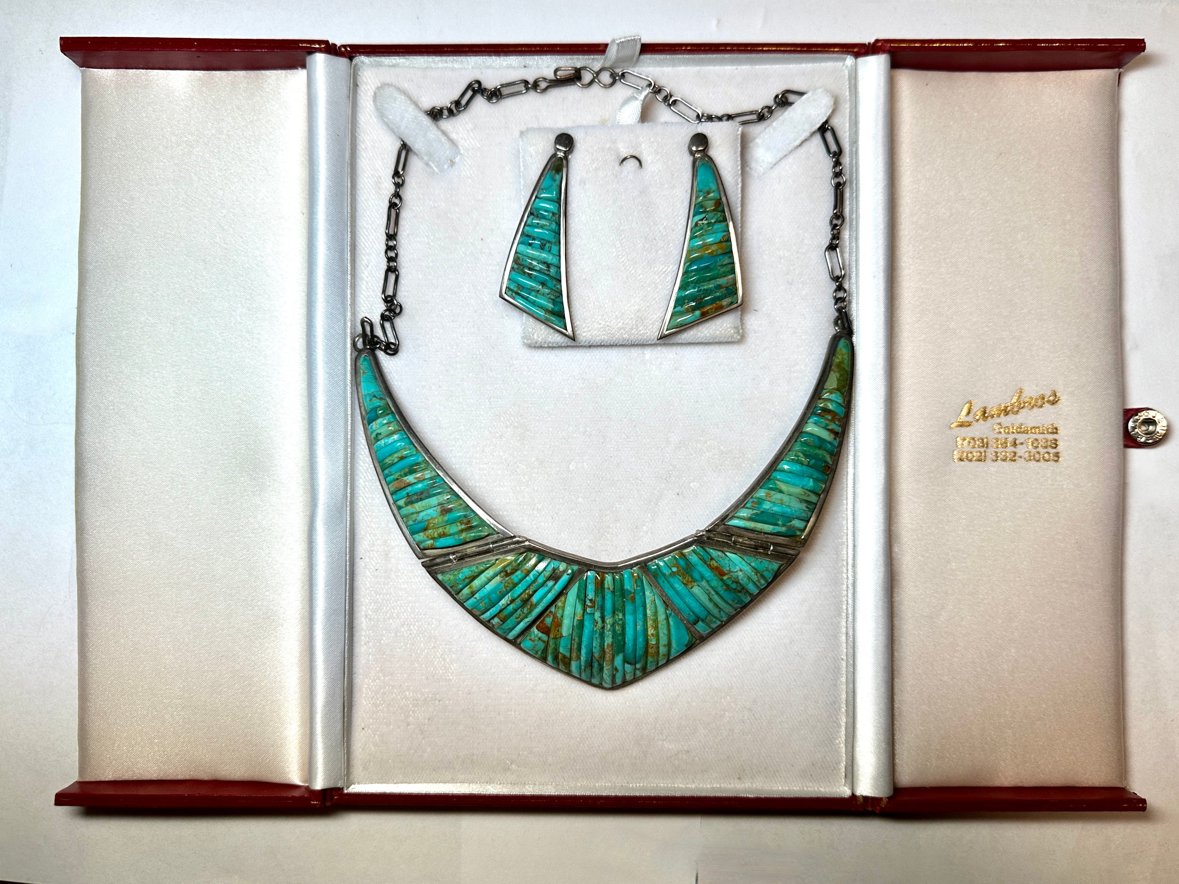 A stunning set of Sterling and Turquoise by the noted Navajo Craftsman Pete Sierra. The set dates to the 1970's we believe. Pete Sierra studied under the master Charles Laloma. The set comprises the necklace and the two earrings. The necklace is