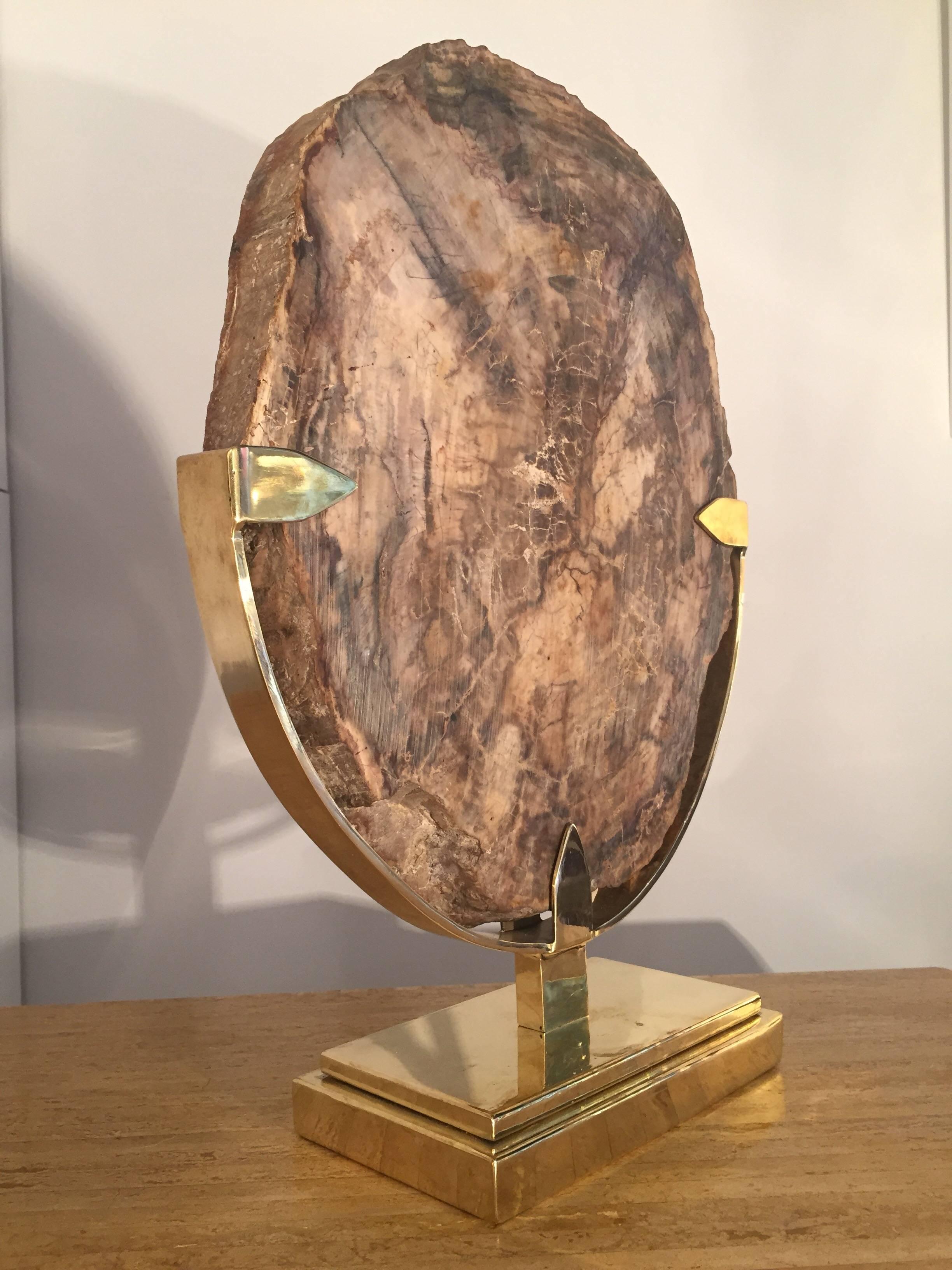 1970s polished petrified wood slice mounted with brass and bronze details.