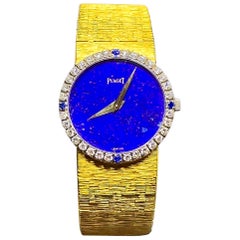 1970s Piaget 18 Karat Yellow Gold Lapis Diamond Sapphire Bracelet Watch