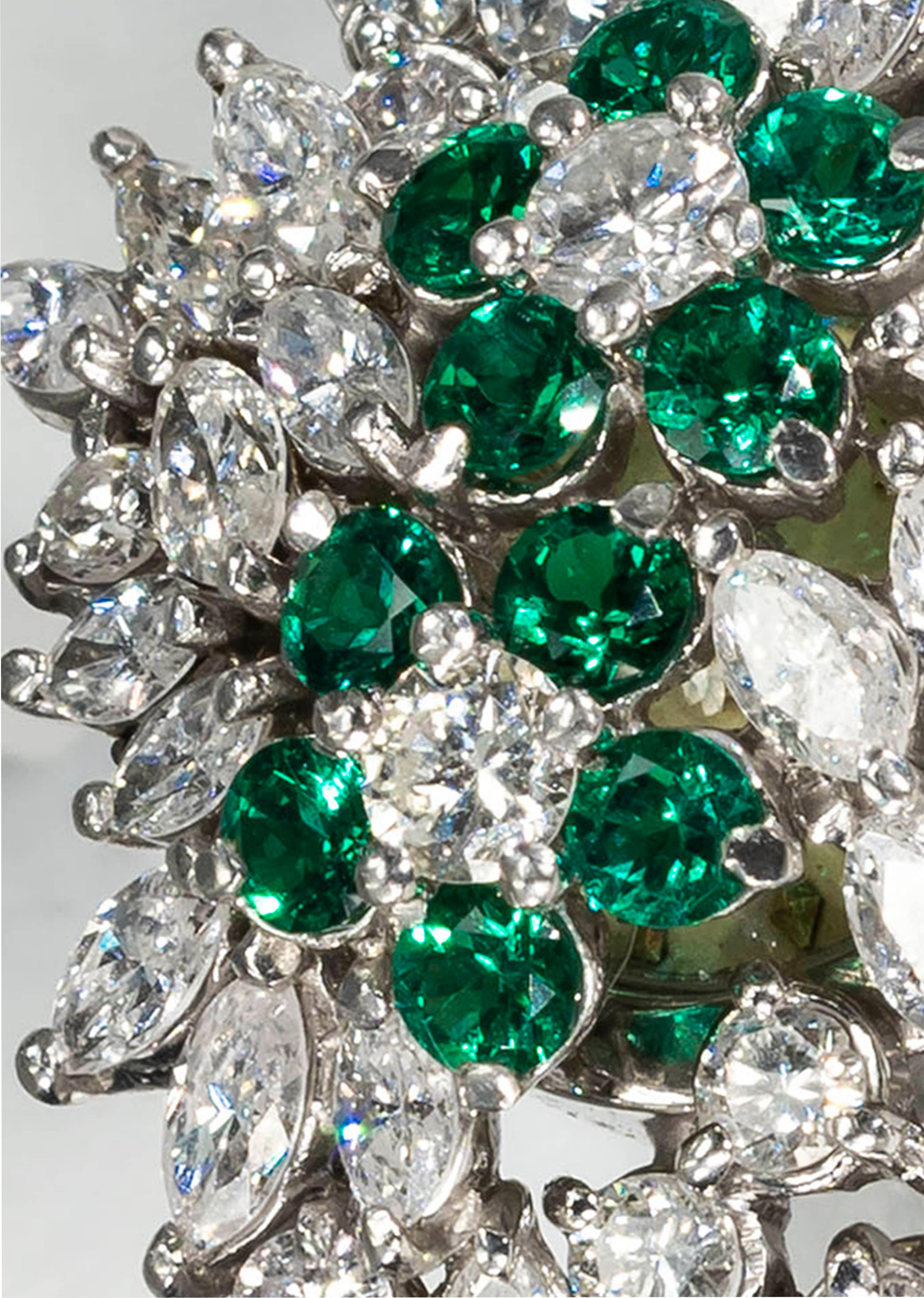 A Very Impressive Special 1970s Platinum Piaget Marquis Cut Diamond & Double Emerald Set Flower Concealed Bracelet Watch with 210 stones
totaling approximately 25 carats

Basic Specifications & Case Dimensions
- 18mm Case Dimension
- 12mm Dial