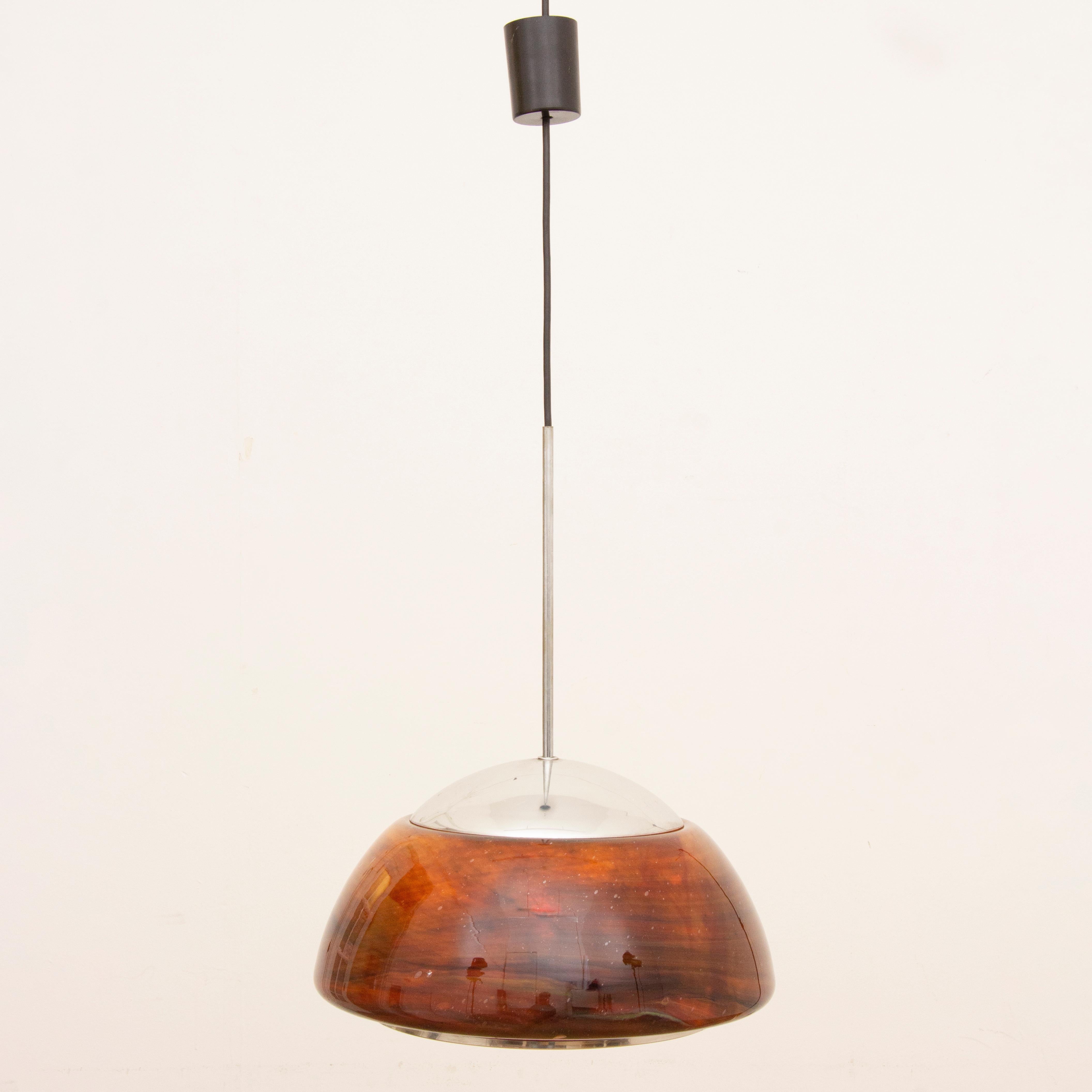 1970s Piell & Putzler space age hanging light with a thick brown and black mottled glass shade suspended from a chrome fitting and black flex. A chrome ring is fitted to the underside of the light. The light is beautiful when lit when the deep