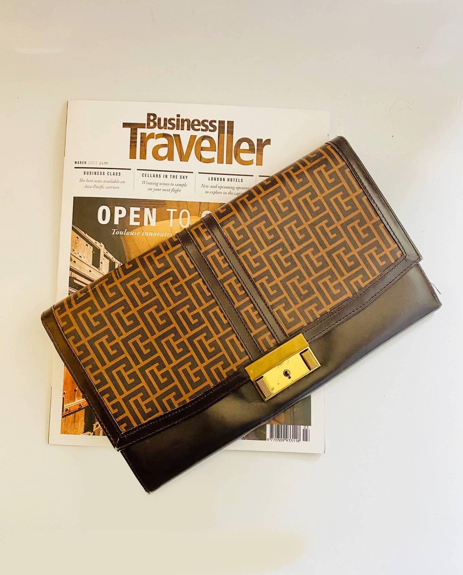 1970s PIERRE BALMAIN clutch bag/travel portfolio/clutch bag with pockets for travel documents and tickets, front clutch closure in gold tone metalware, geometric print on brown leather, this functional accessory supplements any wardrobe with a hint