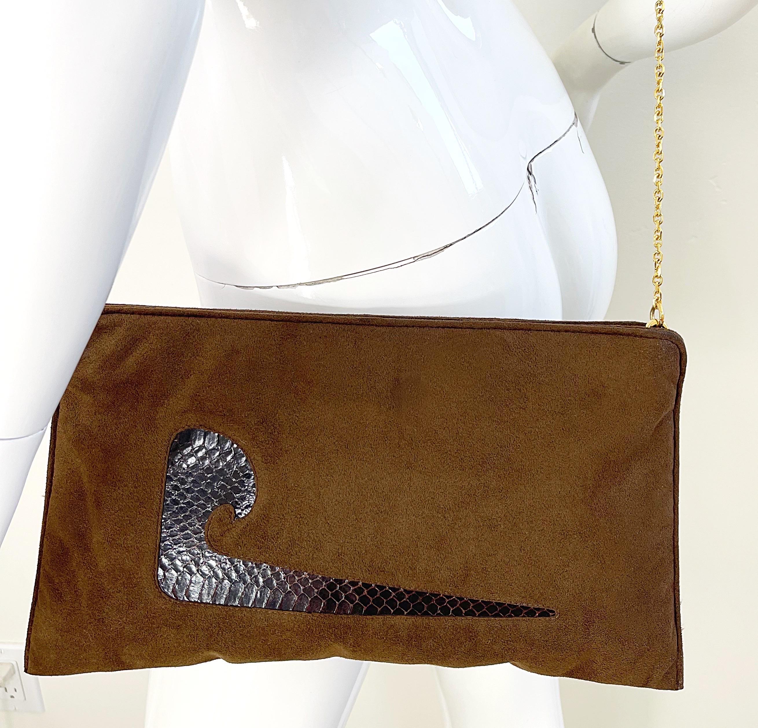 Amazing early 1970s PIERRE CARDIN brown ultra suede and snakeskin large bag, clutch or crossbody ! Hinge closure secures everything. Attached gold chain can be tucked in the bag to wear as a clutch. Can easily dress up or down.
In great