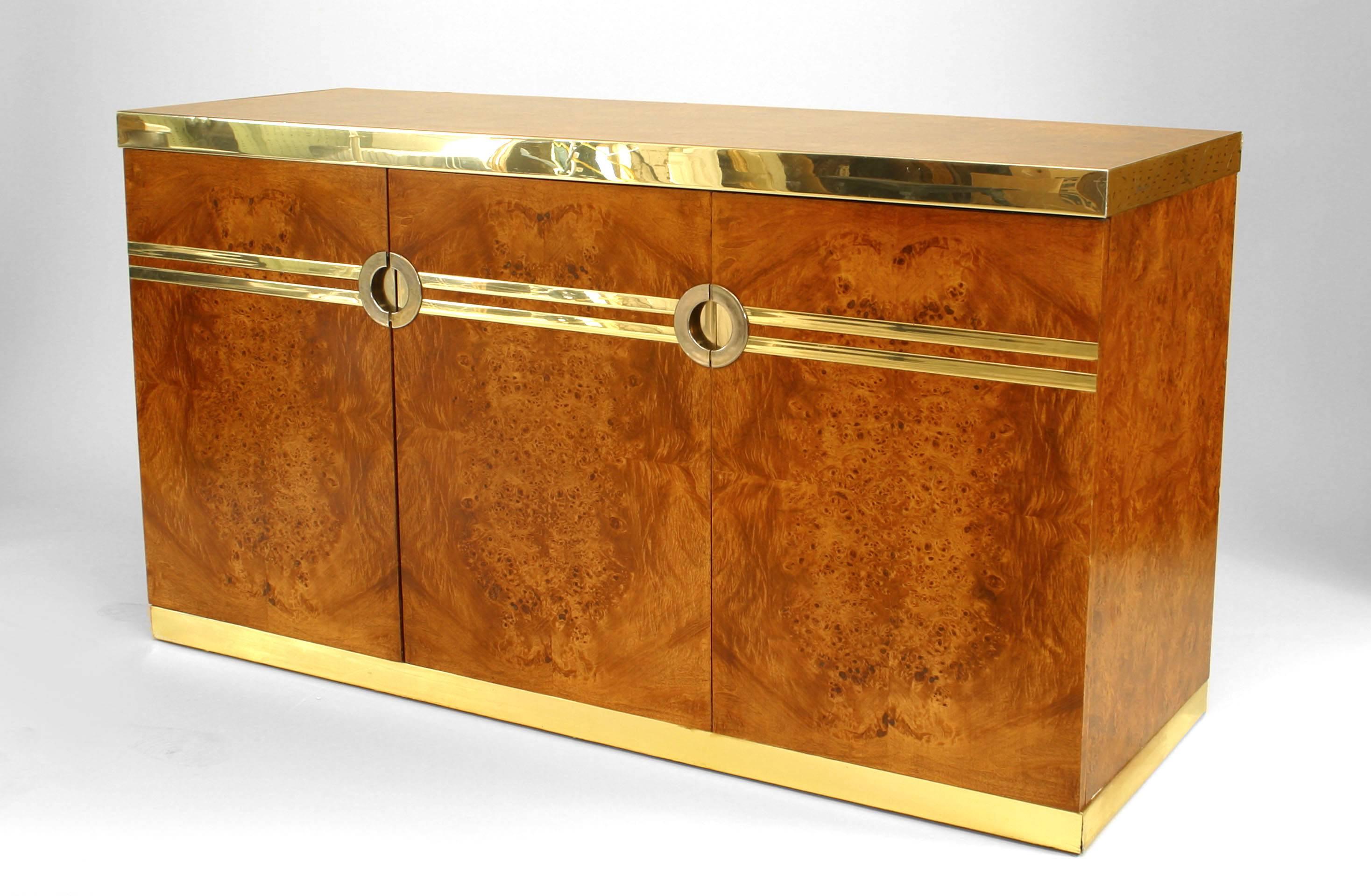 Post War French (1970's) burl walnut buffet with 3 doors and brass trim to top and bottom with 2 parallel brass strips centering 2 handles (signed PIERRE CARDIN)
