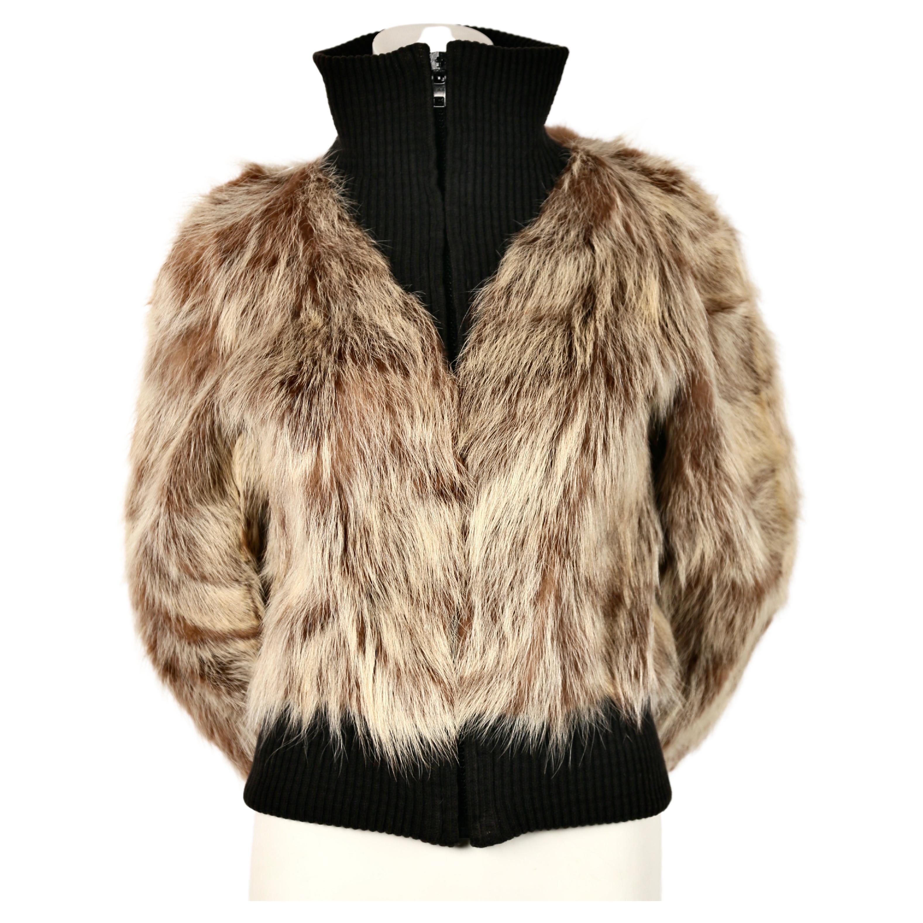 Unique coyote fur coat with soft black ribbed trim from Pierre Cardin dating to the 1970's. Fits sizes 2 through a slim 6. Approximate measurements: shoulders 16