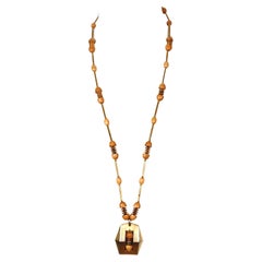 Retro 1970's PIERRE CARDIN long gilt necklace with wood beads