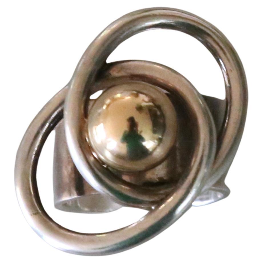Very rare sterling silver ring with 14k gold ball from Pierre Cardin dating to the 1970's. Currently adjusted for a size 6 although this can be made smaller or larger. Signed. Very good condition.