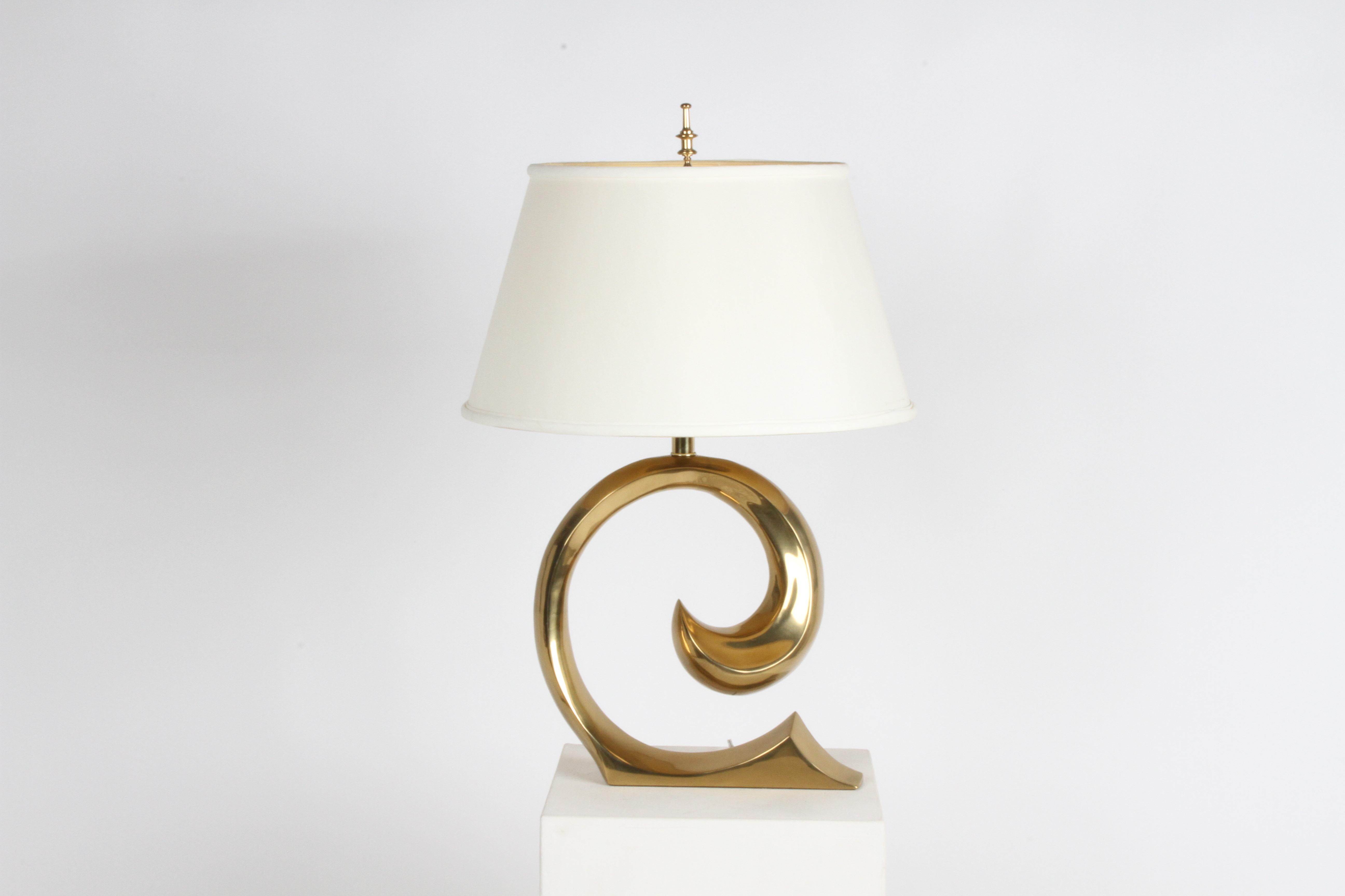 1970s style brass wave table lamp designed by Sante G. Alessandro for Erwin-Lambeth, but know as the Pierre Cardin lamp as it resembles the PC logo. Over all very nice condition & tested. Shade not included 
29