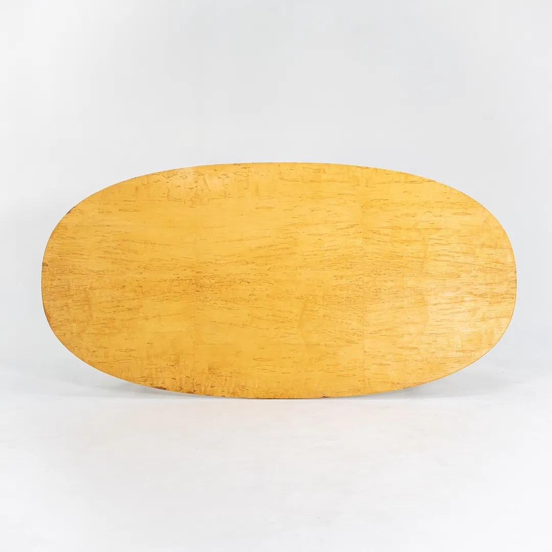 This is a rare and highly figured (or burled) birch dining table from the Superellipse series, designed by Bruno Mathsson, Piet Hein, and with collaboration from Arne Jacobsen as well. The table was produced by Fritz Hansen in Denmark. This is a