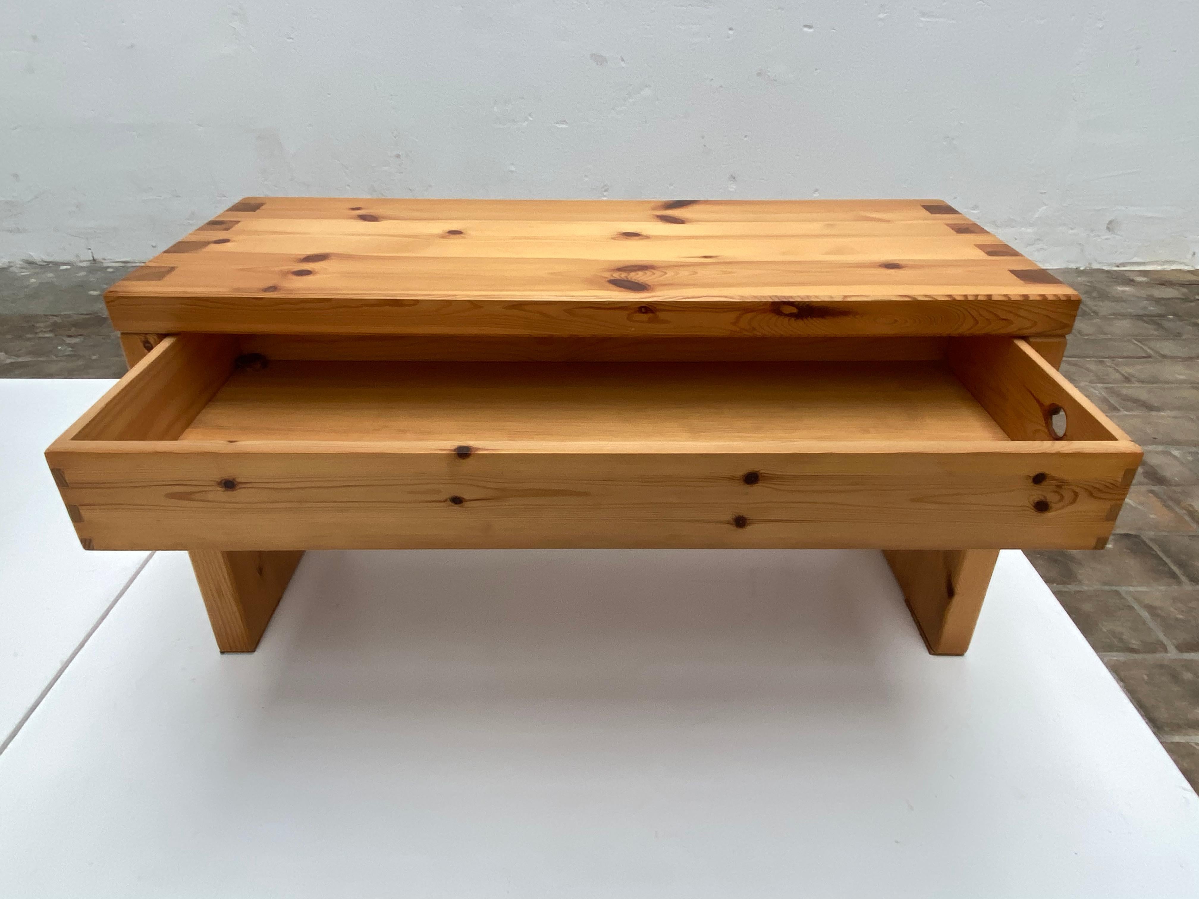 Beautiful minimal solid pine wood made 1970s side table with a single large drawer

Marked Aksel Kjersgaard 

This Danish designer is a master in showing off the refined Scandinavian design by exposing the skilled construction details in the