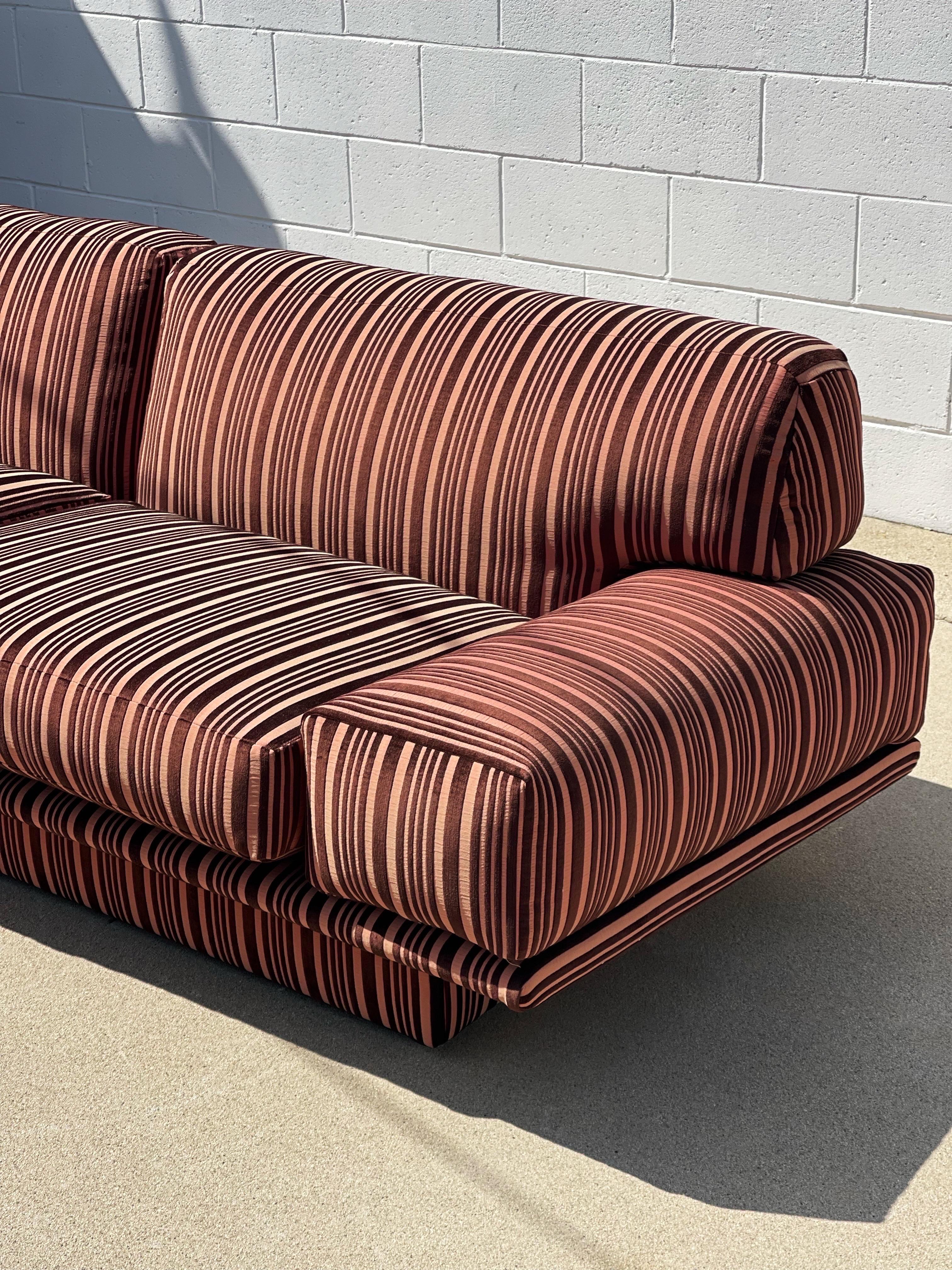 A stunning original 1970s floating frame, newly reupholstered in pink and brown velvet striped fabric. In beautiful, brand new condition ready for another 40 years.