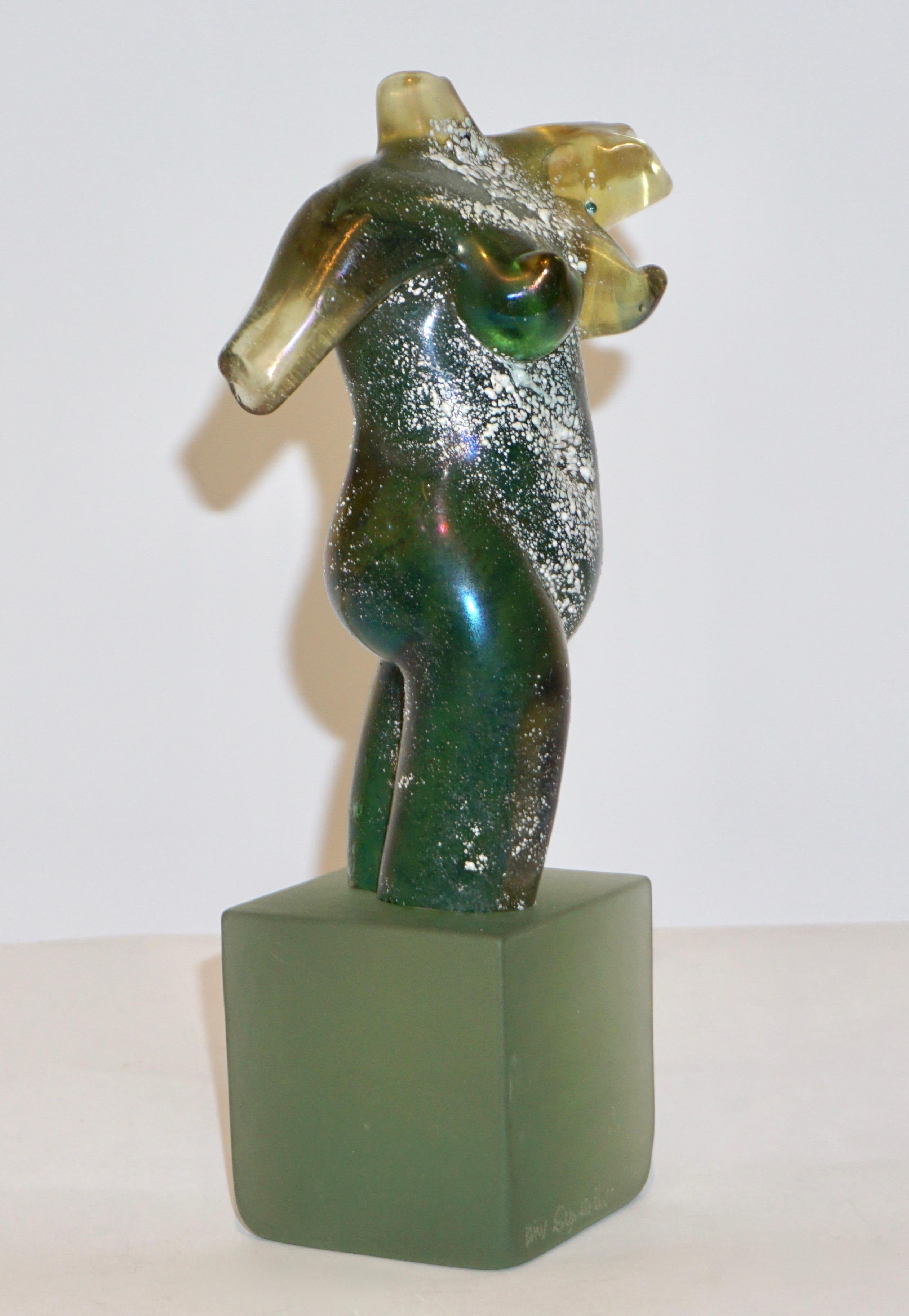 An exquisite vintage Work of Art signed Pino Signoretto, an iridescent nude sculpture in a sophisticated aqua green blown Murano glass, textured with the technique scavo that creates shimmering reflections and gives movement to the piece, raised on