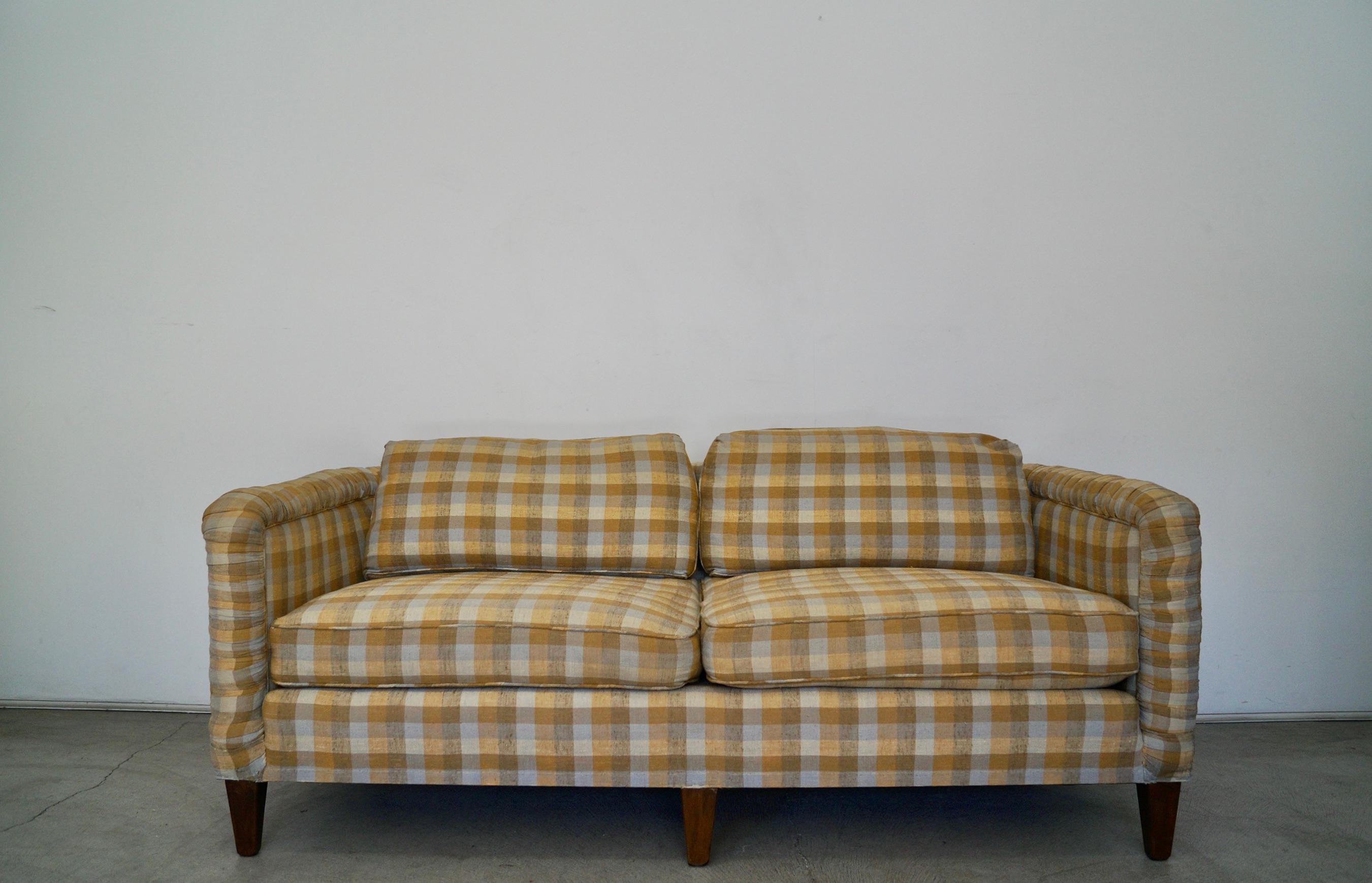 Vintage 1970s couch for sale. Manufactured by Beverly Interiors in California in 1975, and still retains the original tag. The quality and craftsmanship of the frame is outstanding. It has coil springs on the seat with down filled feather seat and
