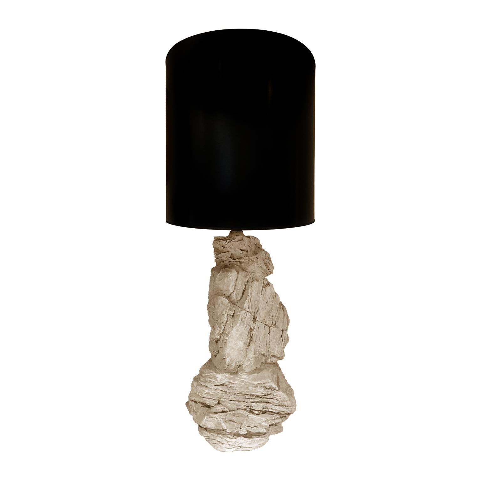 Plaster rock lamp in original finish with black oval shade. Marked 