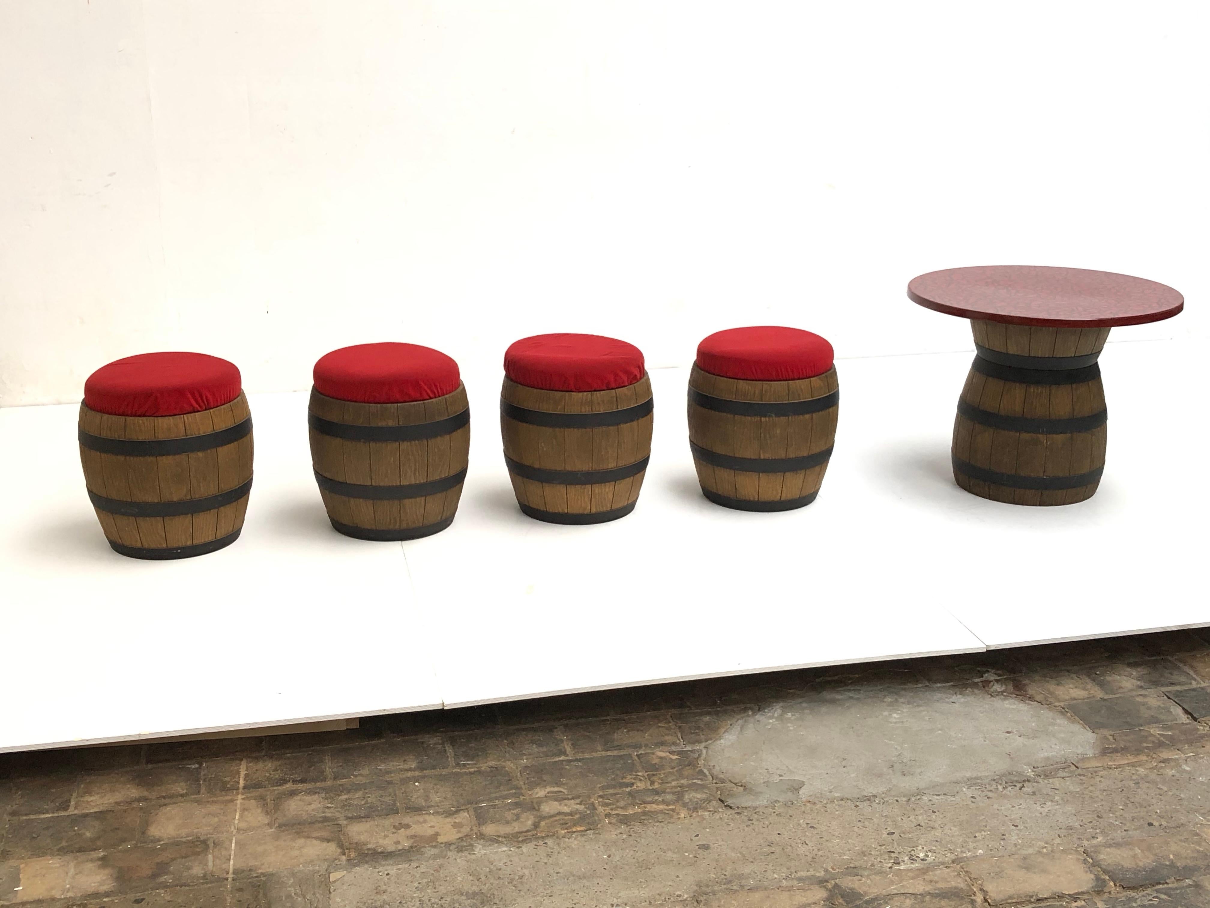Unique drinking table and stools manufactured by Emsla in Germany in the 1970s. 

This 'Whiskey Barrel' set consisting of a table with 4 stools
1 of the 4 stools has a pressed styrofoam cooling compartment (for your drinks and ice), the other 3