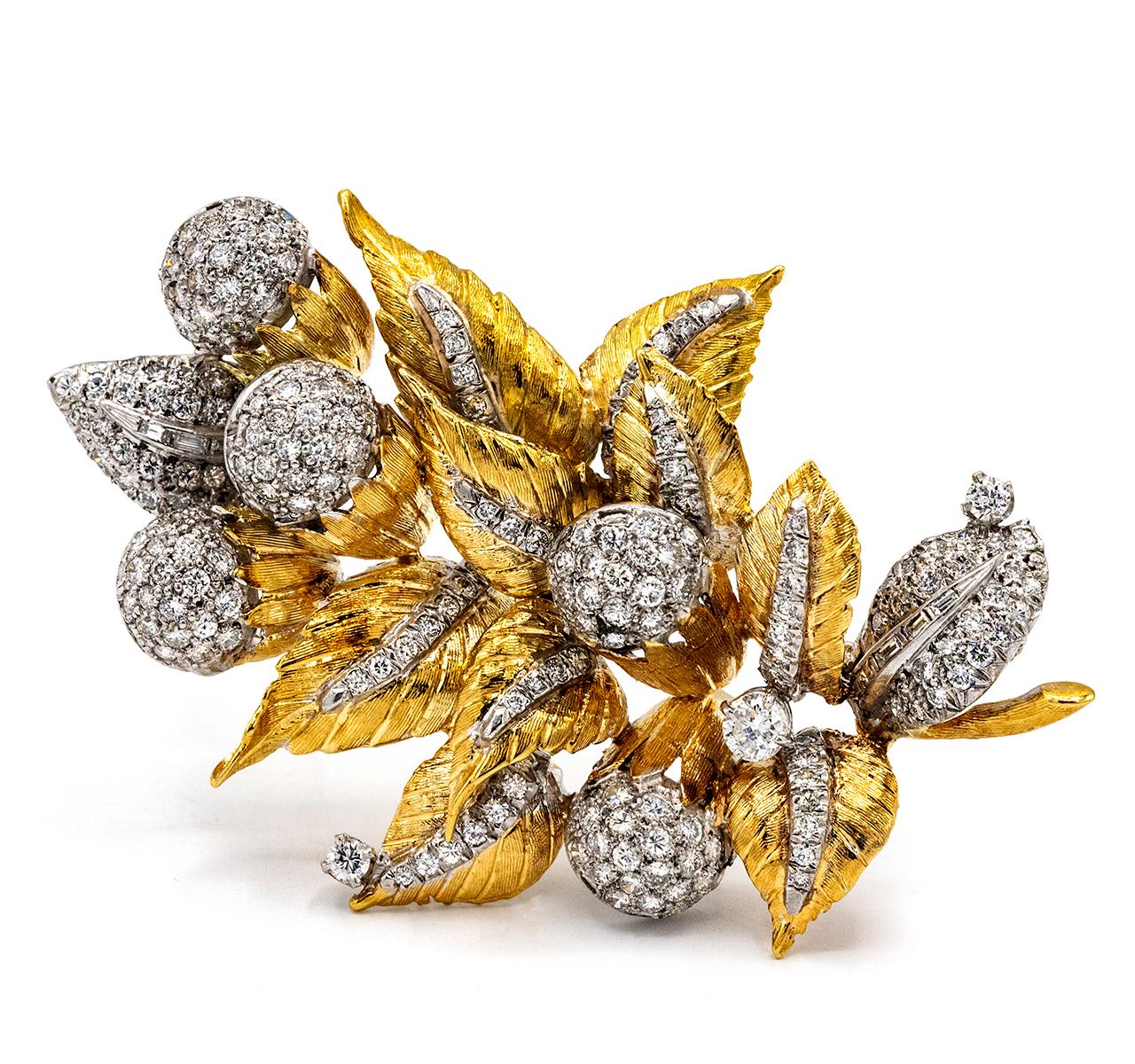 1970's Platinum & 18K Yellow Gold Foliage Round & Baguette Cut Brooch.

Add a touch of foliage to your simple blouse or jacket all year round! This stunning vintage sparkling leaf pin features 12 ct. t.w. round brilliant-cut and diamond baguettes in