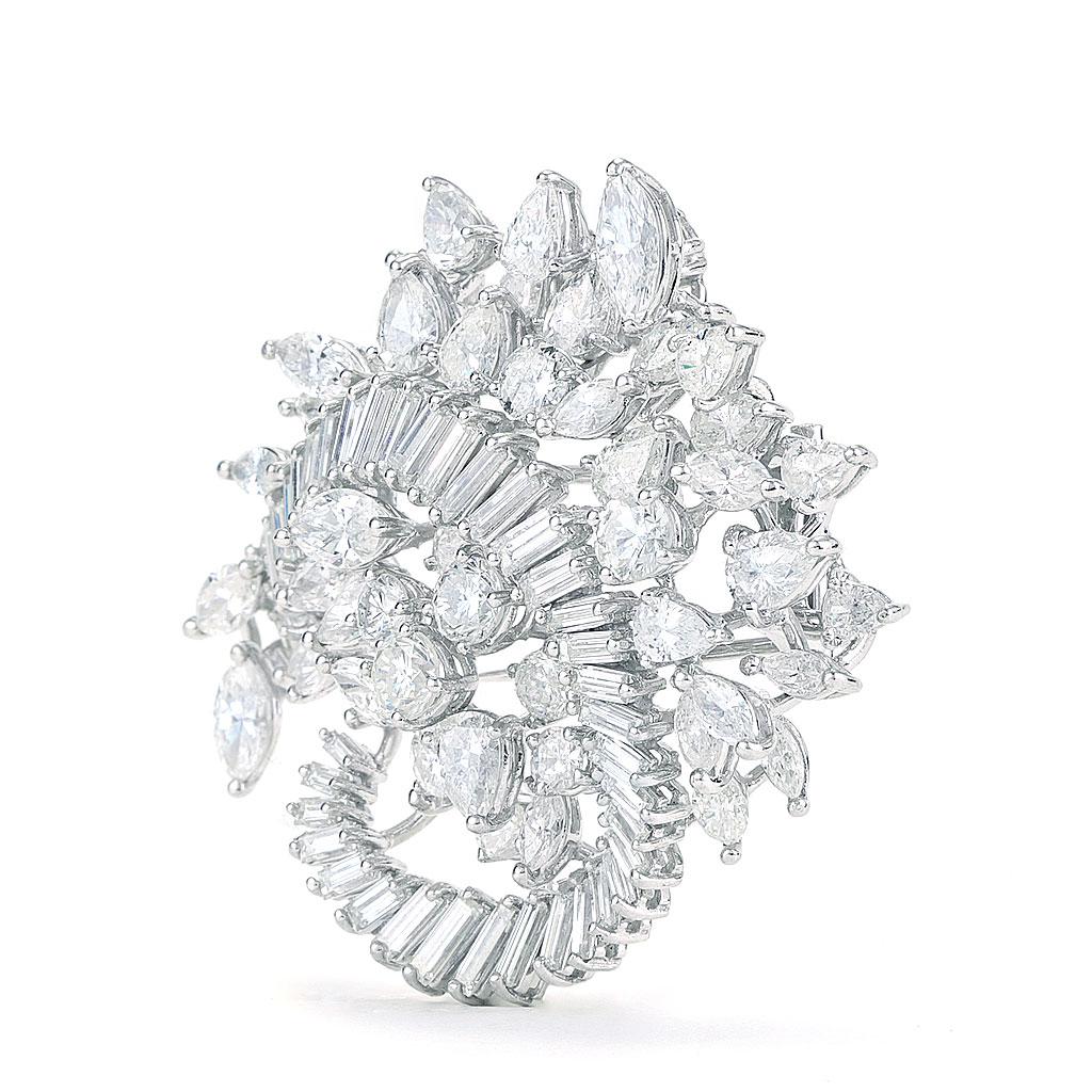 Made of platinum and weighs 15.70 DWT (approx. 24.42 grams). It contains 10 round diamonds weighing 3.00 CTTW, 41 baguette G-H color, VS clarity diamonds weighing 5.00 CTTW, 16 pear diamonds weighing 4.00 CTTW, and 23 marquise diamonds weighing 6.00