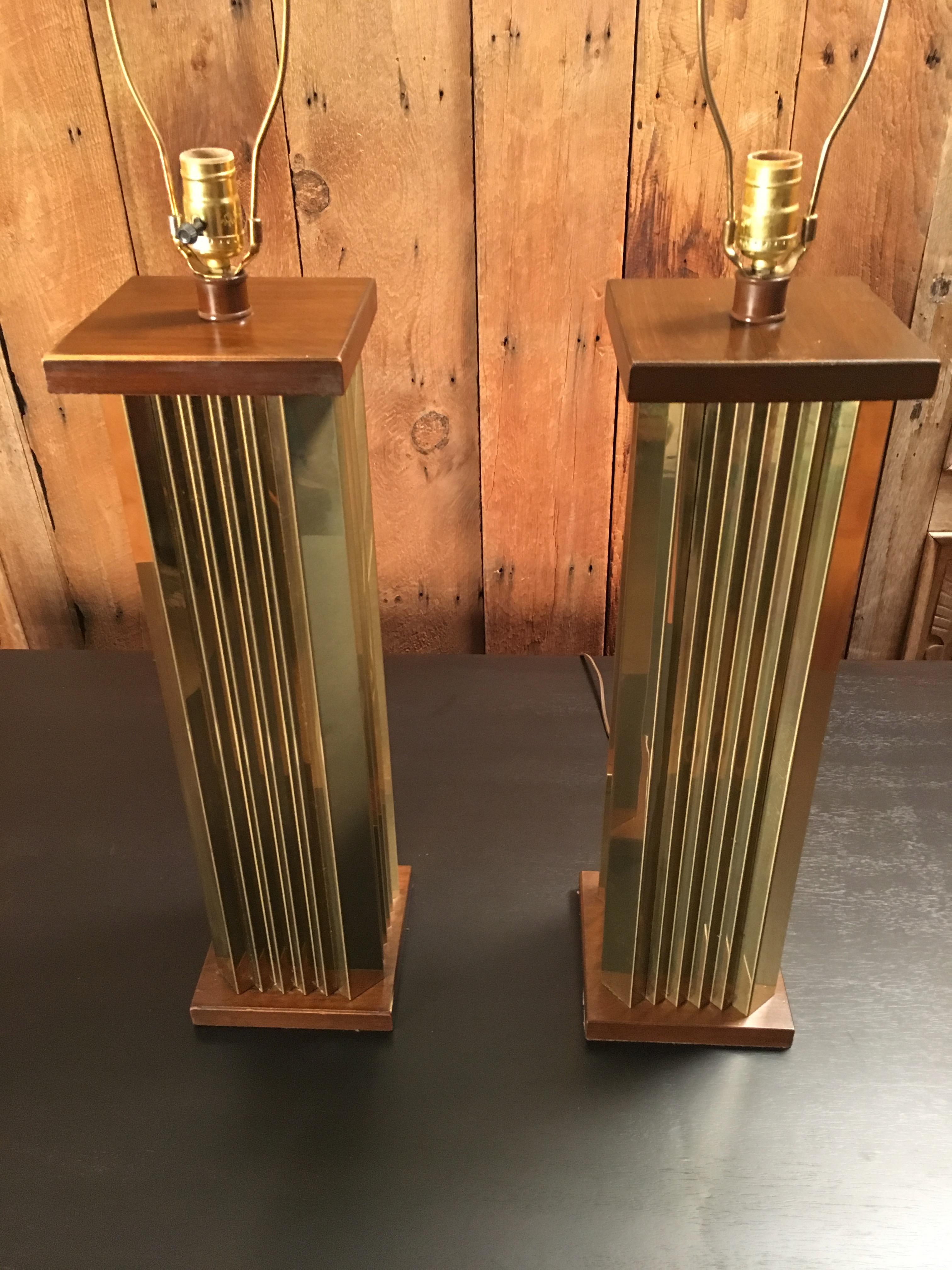 Pleated brass with wood on top and bottom
Shades are not included 34