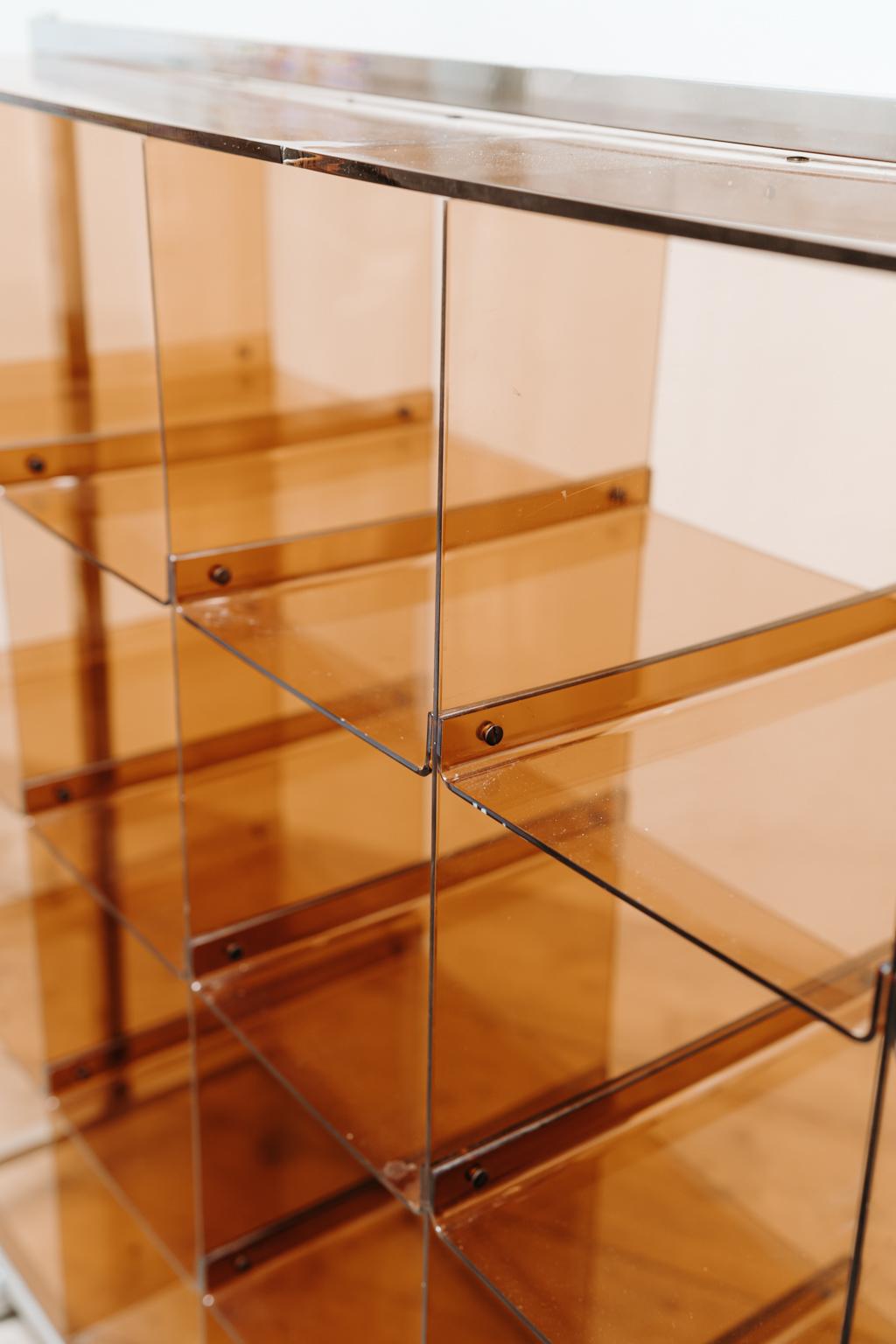 A rare find this plexiglass bookcase on wheels, made in the 1970's in France, 
some scratches but in overall good vintage condition ...