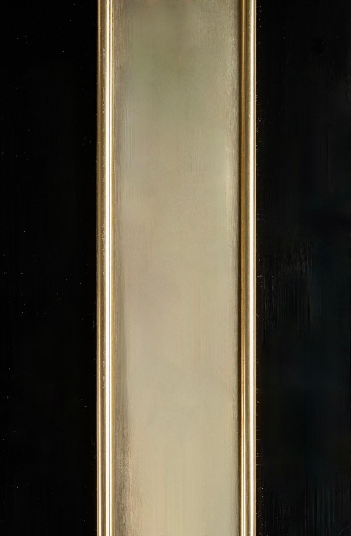 Mirror of the 70's composed of a large black plexiglass frame underlined in its center by a band of gilded brass elegantly underlined the mirror.
Original mirror.