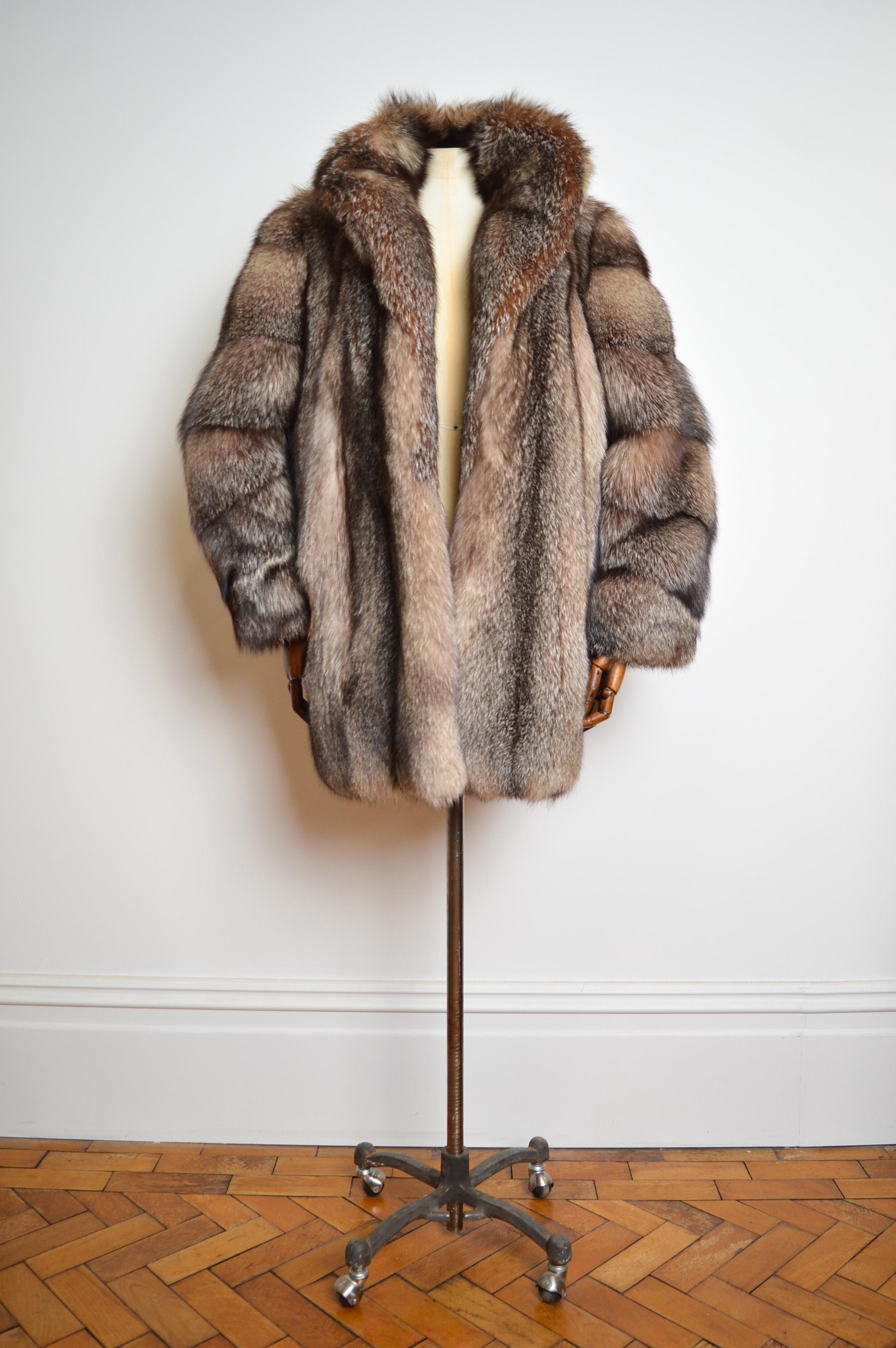 Incredible, Opulent Vintage 1970's Arctic Fox fur Coat in Silvery Brown Tones.  

This exceptional Vintage Fur Jacket features extremely Plush, thick Pelts of soft Natural Arctic Fox (Vulpes Lagopus), Hip Pockets pockets, Interior Pocket, central