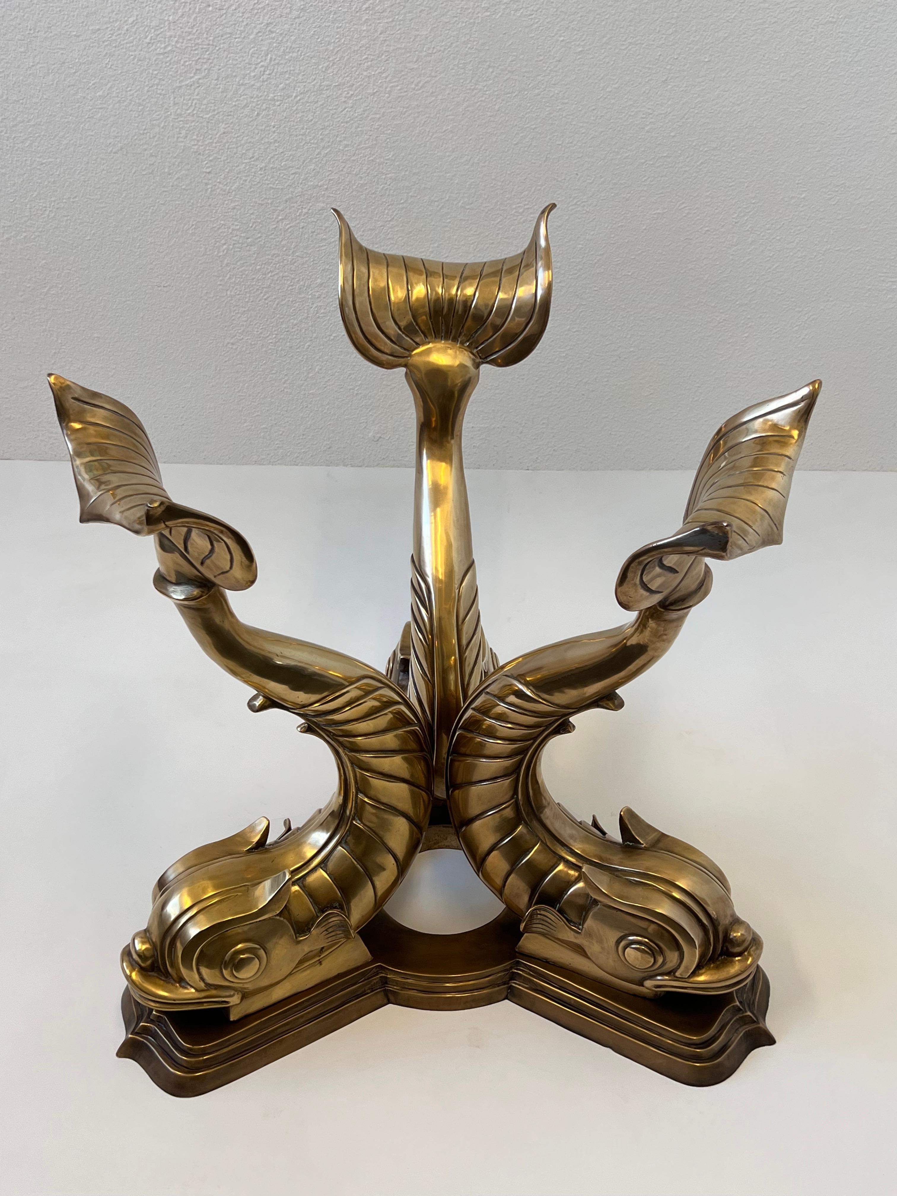 Glamorous 1970’s three bronze fish entry table. 
Constructed of cast bronze, the fish are polish with no lacquer and the base has an aged finish to it. Small defect on one corner of base( see detail photos). 

Price is just for base. We can order