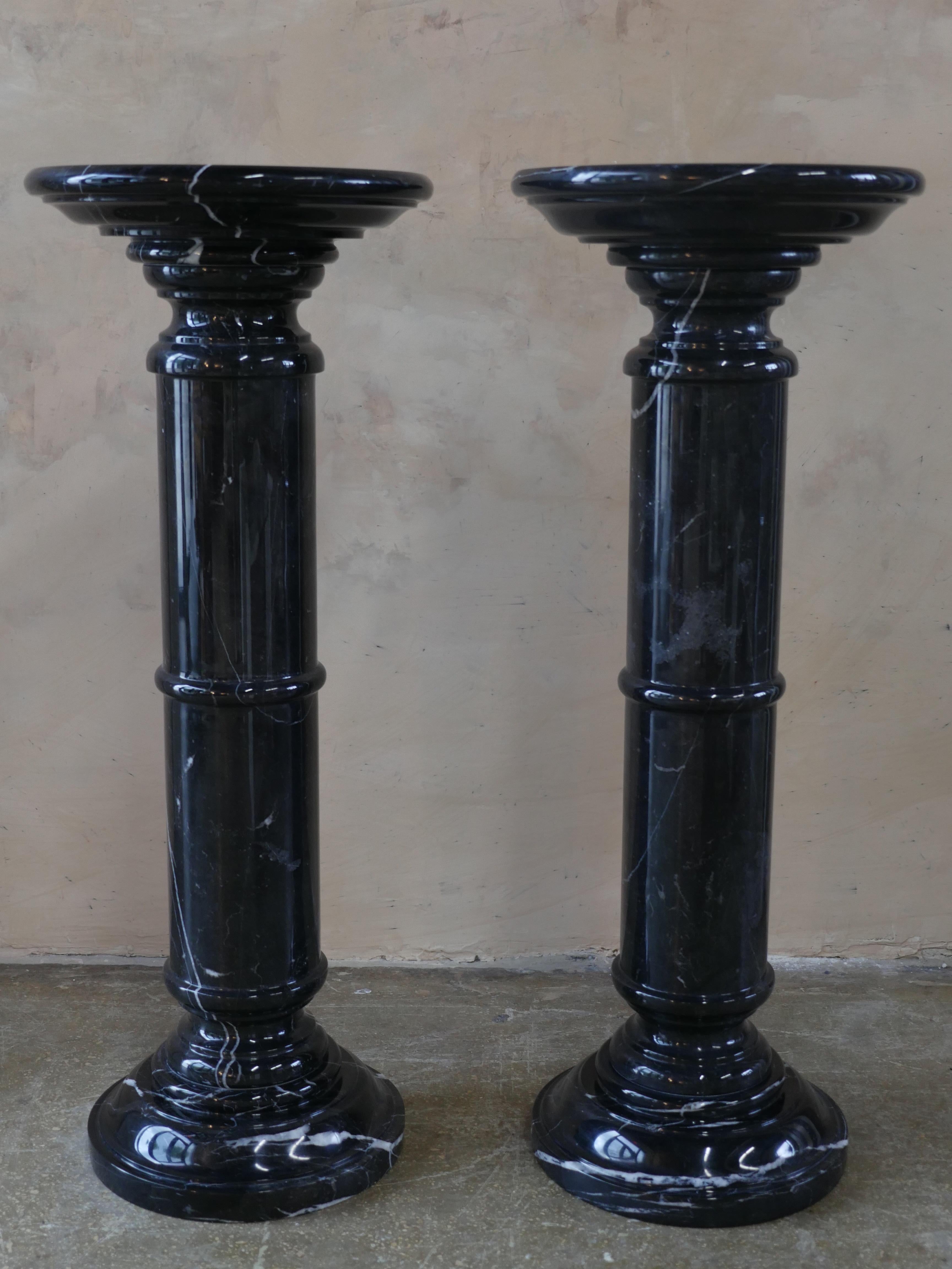 Beautiful pair of 1970s Nero Marquina Marble pedestals. The pedestals are in great condition as they have been professionally polished by hand, to achieve a stunning, reflective look.