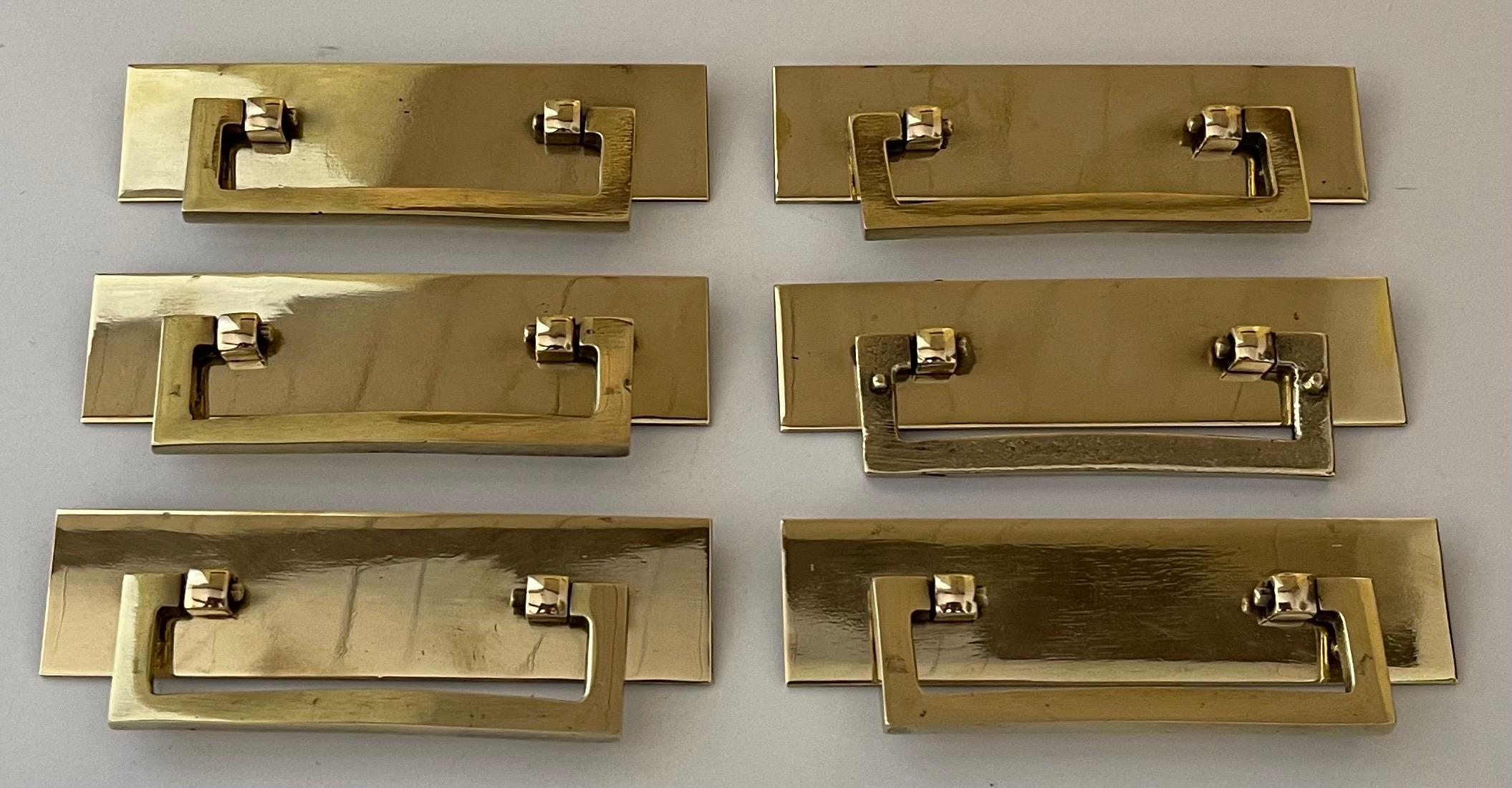 Set of six 1970s polished solid brass camping style drawer pulls. Newly professionally polished to a high shine. Mounting hardware is not included. 