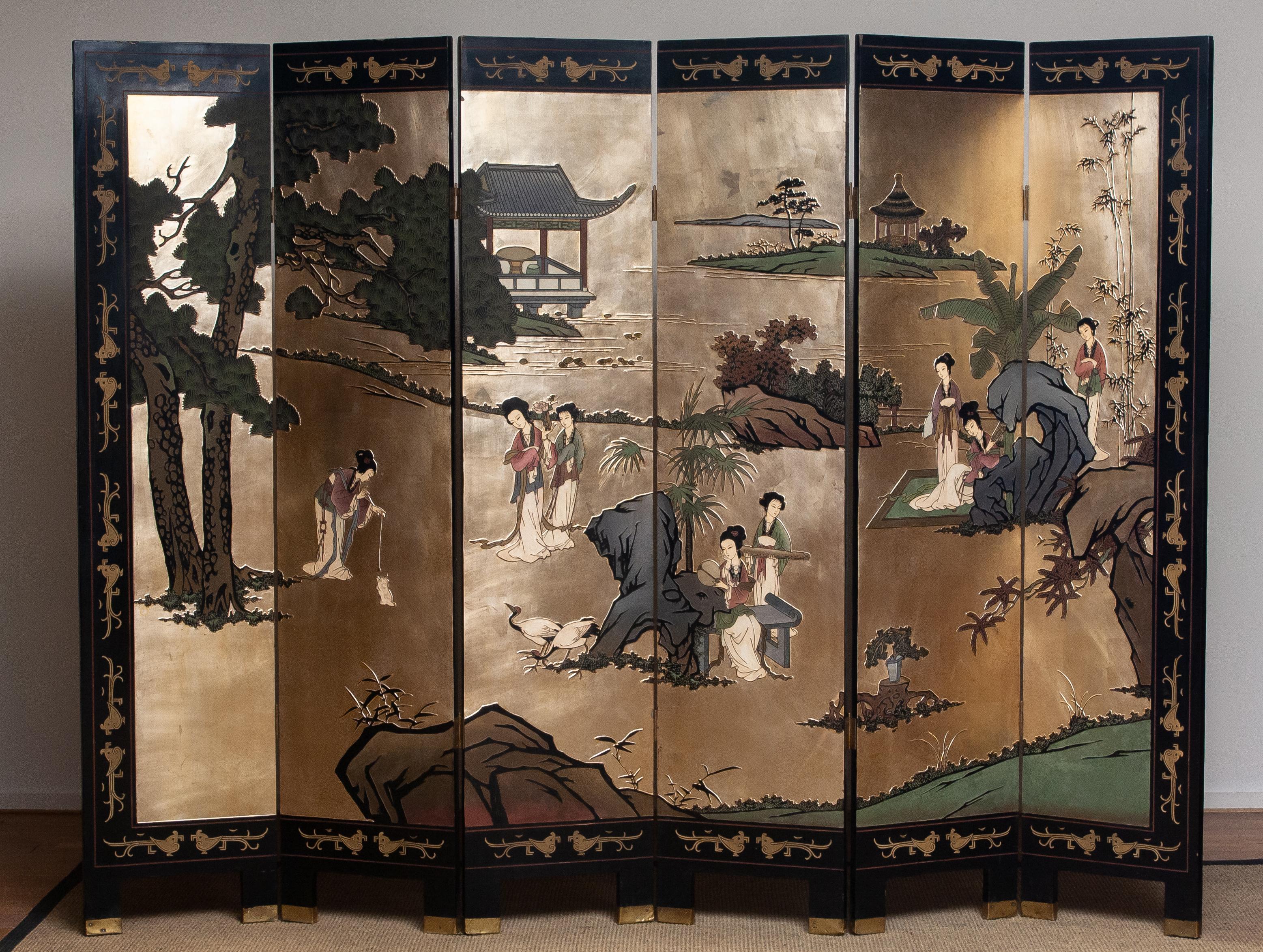 Beautiful gold-plated double face chinoiserie bakelite polychromed with 3D effect folding screen from the end of the 1970s, China.
Measures: Height 183cm or 72 inches
Wide 246cm or 97 inches.