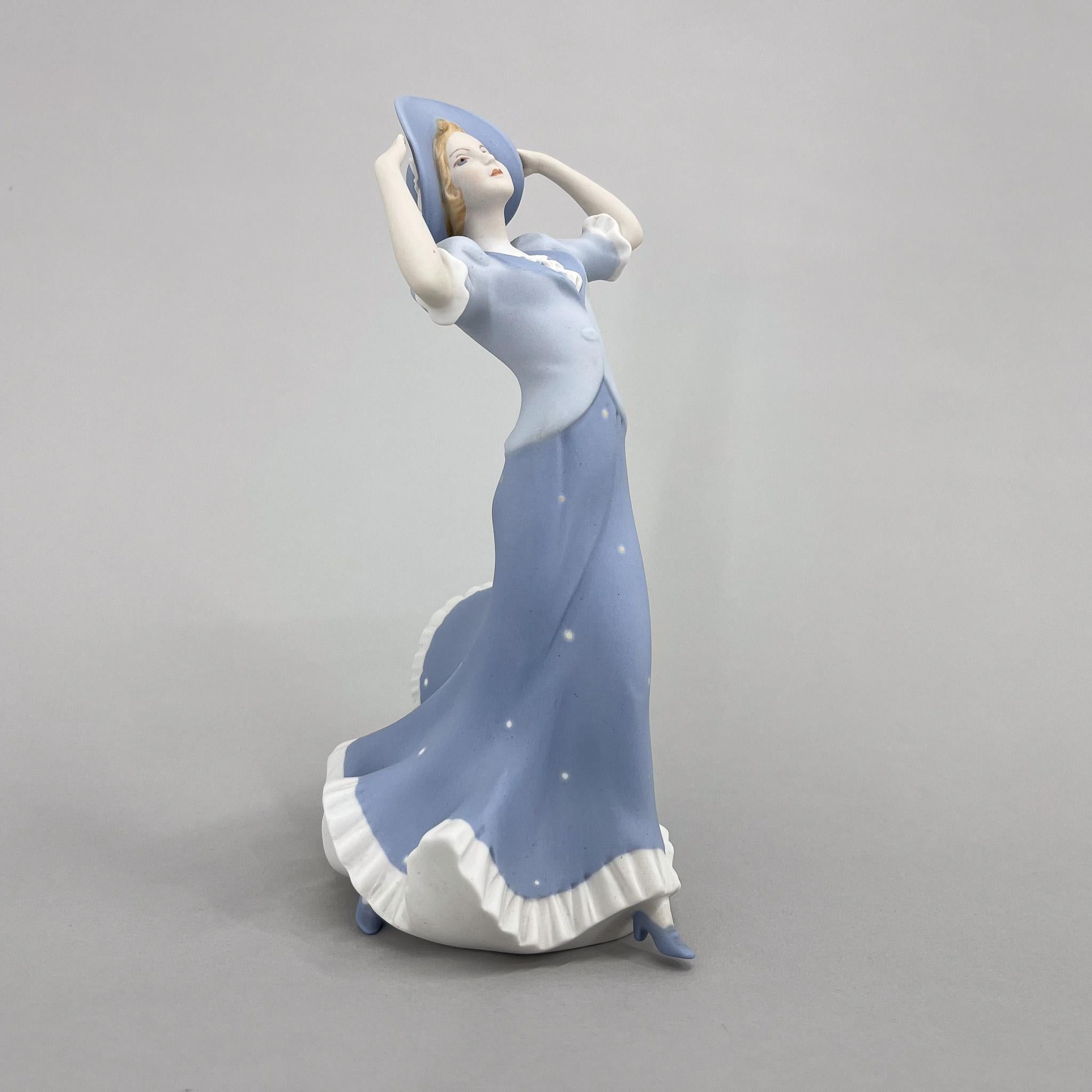 Vintage porcelain statue called 'Women with hat', produced by famous Royal Dux in former Czechoslovakia in the 1970's.1970s Porcelain Sculpture 'Lady with Hat' by Royal Dux