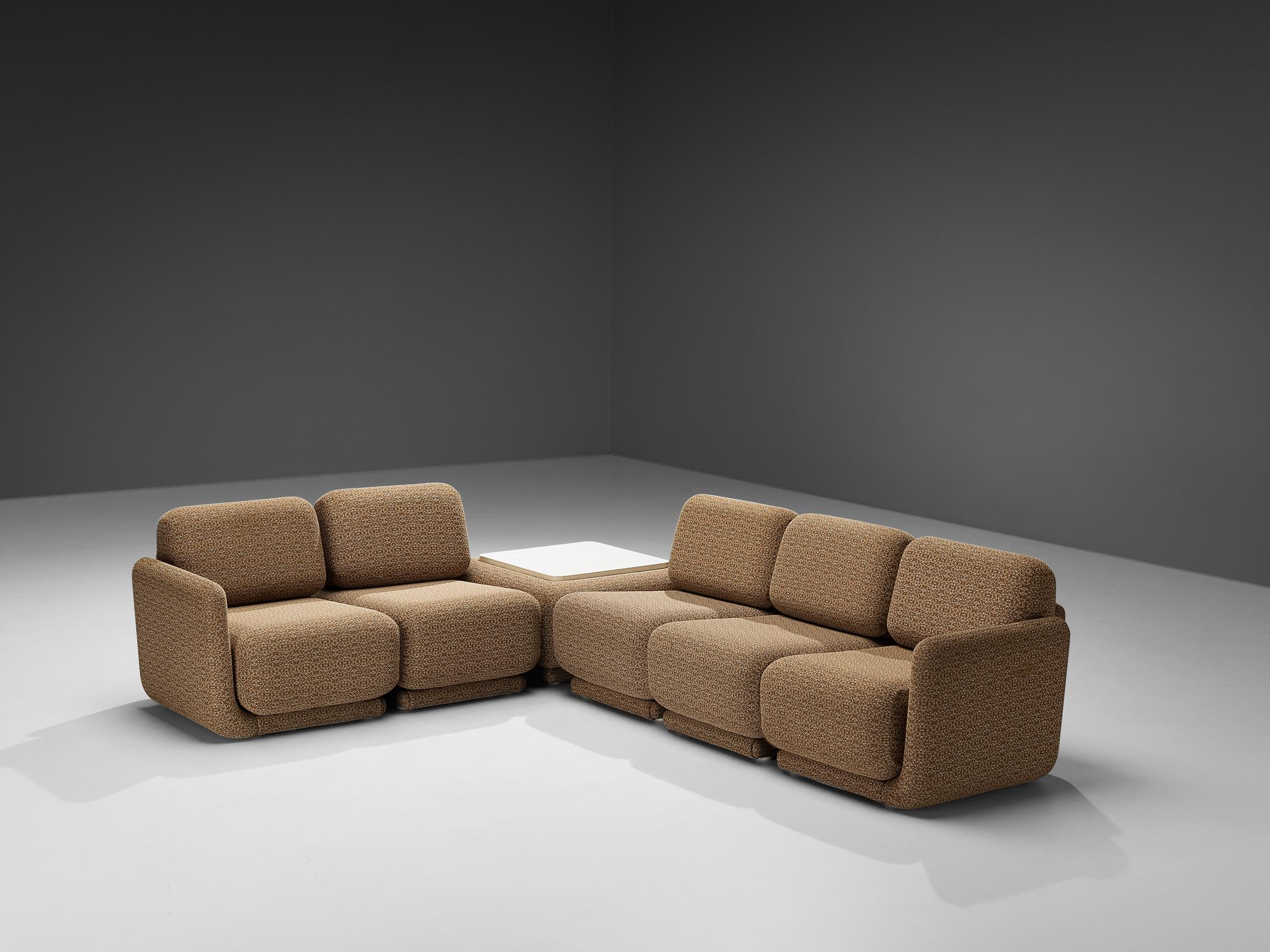 Modular sofa with coffee table, fabric, laminated wood, Belgium, 1970s

This superb sectional sofa hails from 1970s Belgium, epitomizing the post-modern spirit with its bold departure from strict modernist conventions and playful exploration of