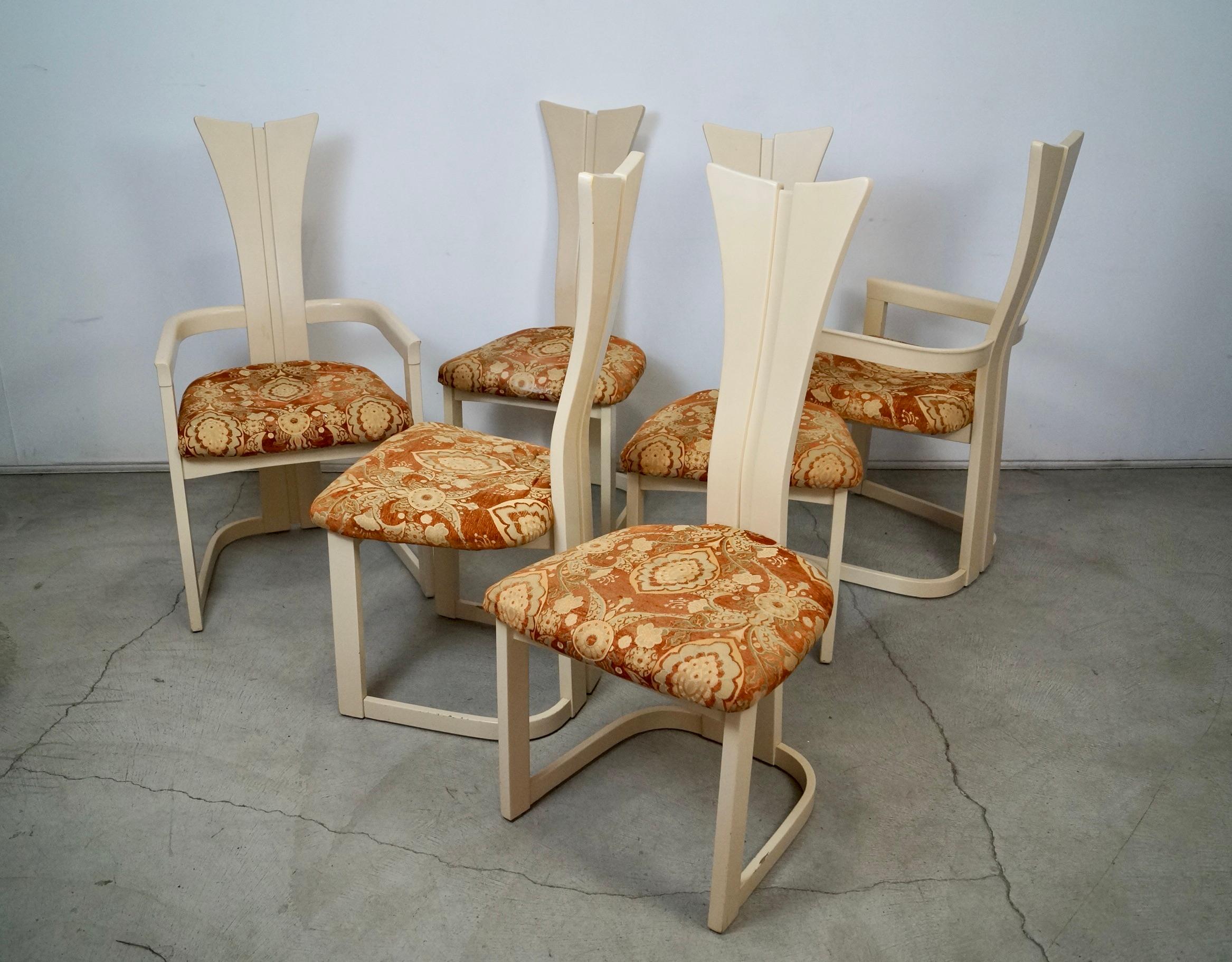Vintage 1970's Post Modern dining chairs for sale. They have the original off-white cream lacquer, and were previously reupholstered in the 1990's. The cushions show vintage wear, so they're best off being reupholstered. The original lacquer is
