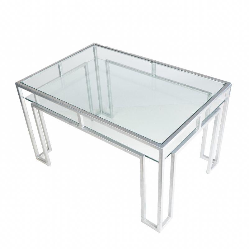 Postmodern coffee table in powder coated forged steel with a glass top and lower glass shelf.
American, circa 1970.