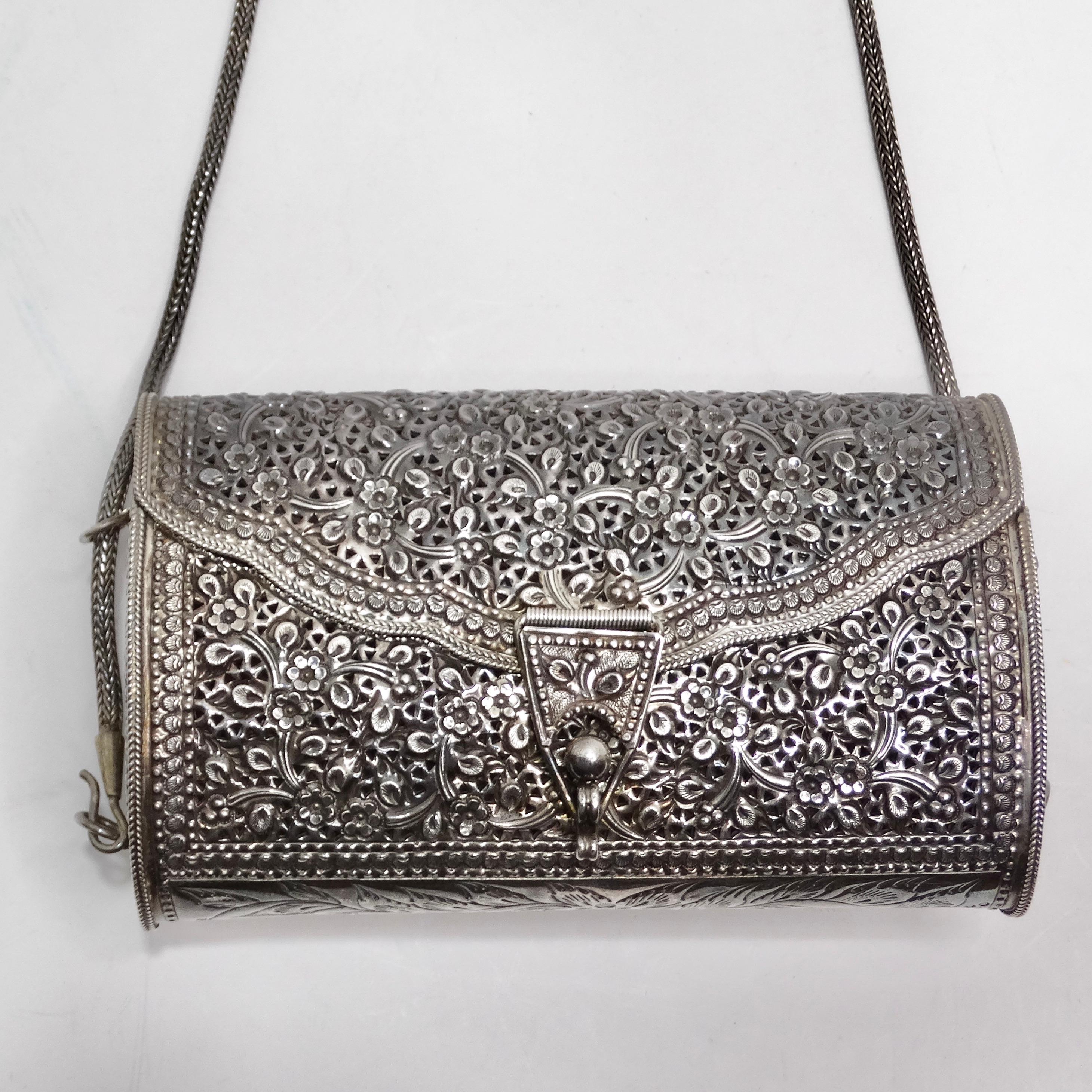 Get your hands on this 1970s Pure Silver Crossbody Handbag, a rare and captivating piece of fashion history that seamlessly blends elegance and versatility. This handbag is more than just an accessory; it's a unique statement of style and
