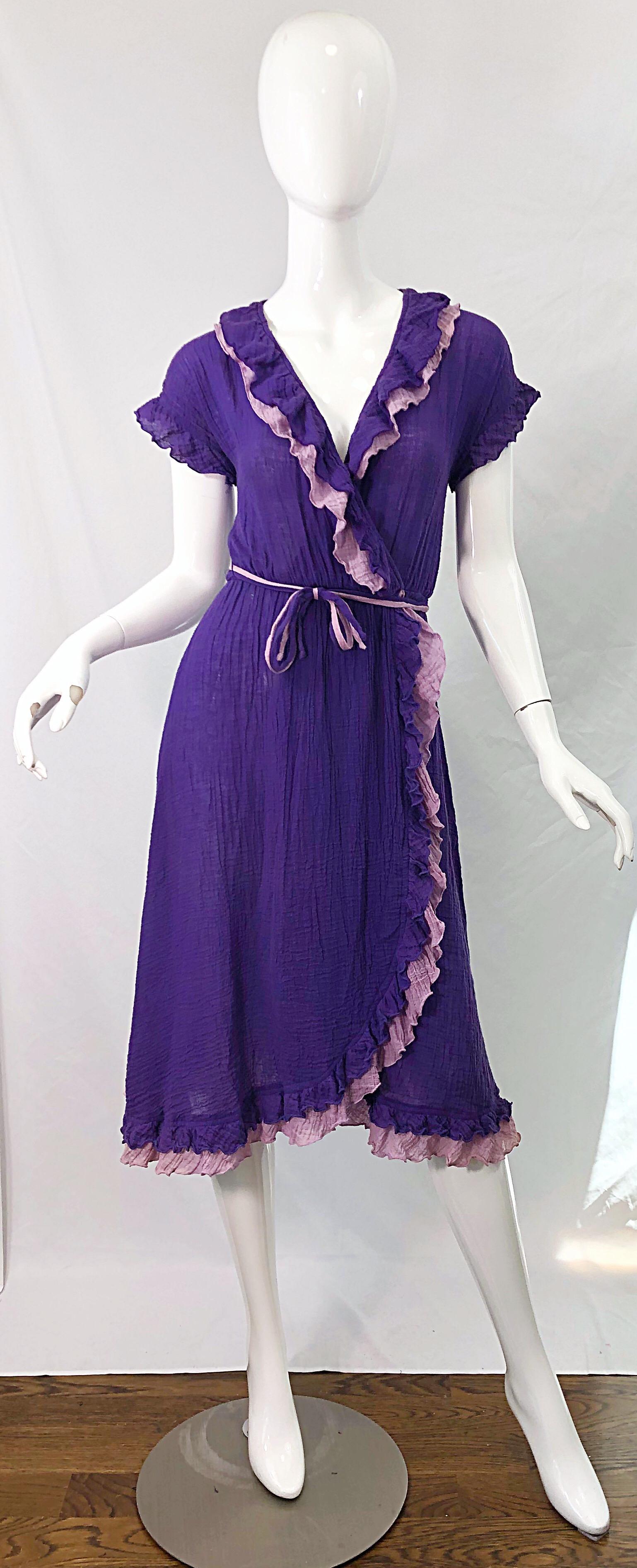 Amazing 1970s purple and lavender lightweight cotton voile short sleeve wrap dress ! Features a vibrant regal purple with lavender ruffle details. Elastic waistband. Both colors on each of the belts. Light and breezy perfect for any time of year.