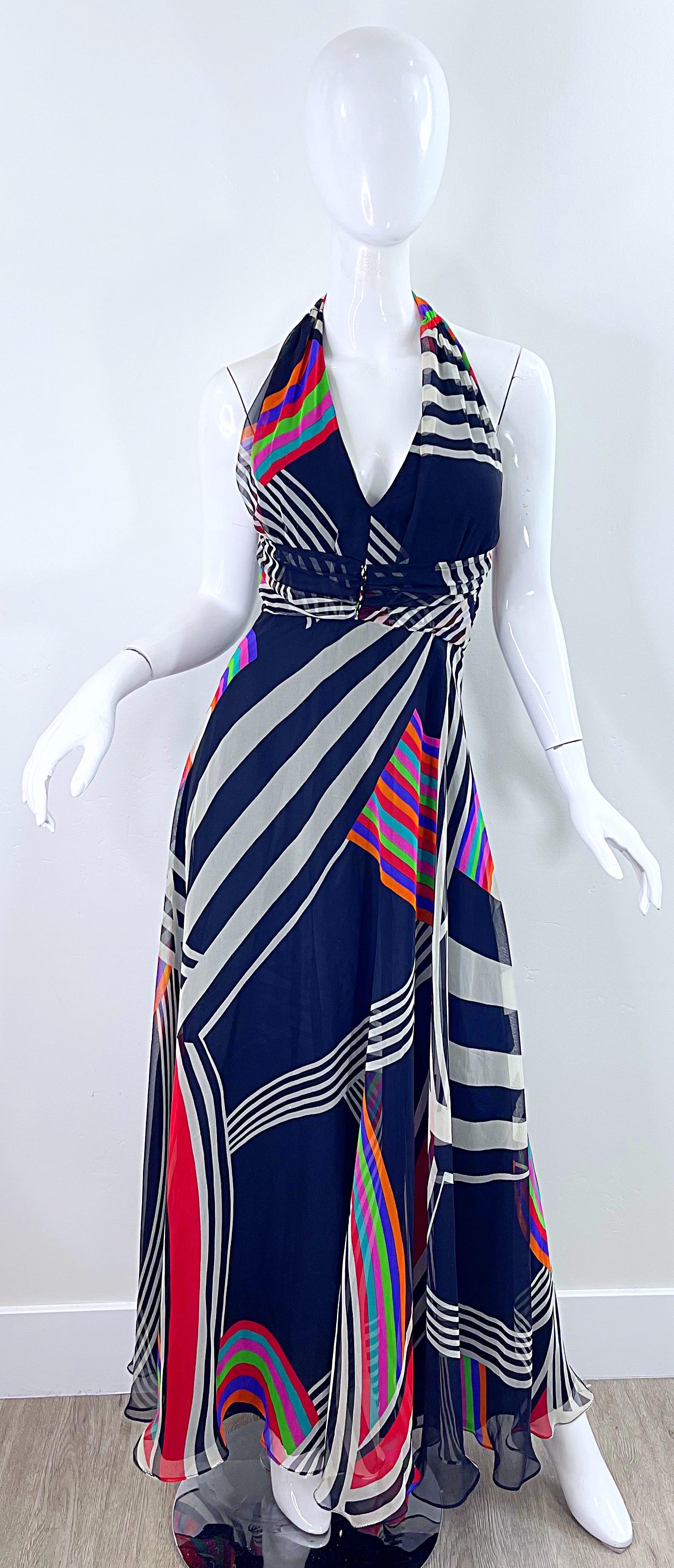 Amazing 1970s PUSZTA black abstract print striped chiffon maxi dress ! Features bright colors of red, blue, orange, pink, green, turquoise, and white on a black background. Hidden zipper. Up the back.Perfect for any day or evening event. Pair with