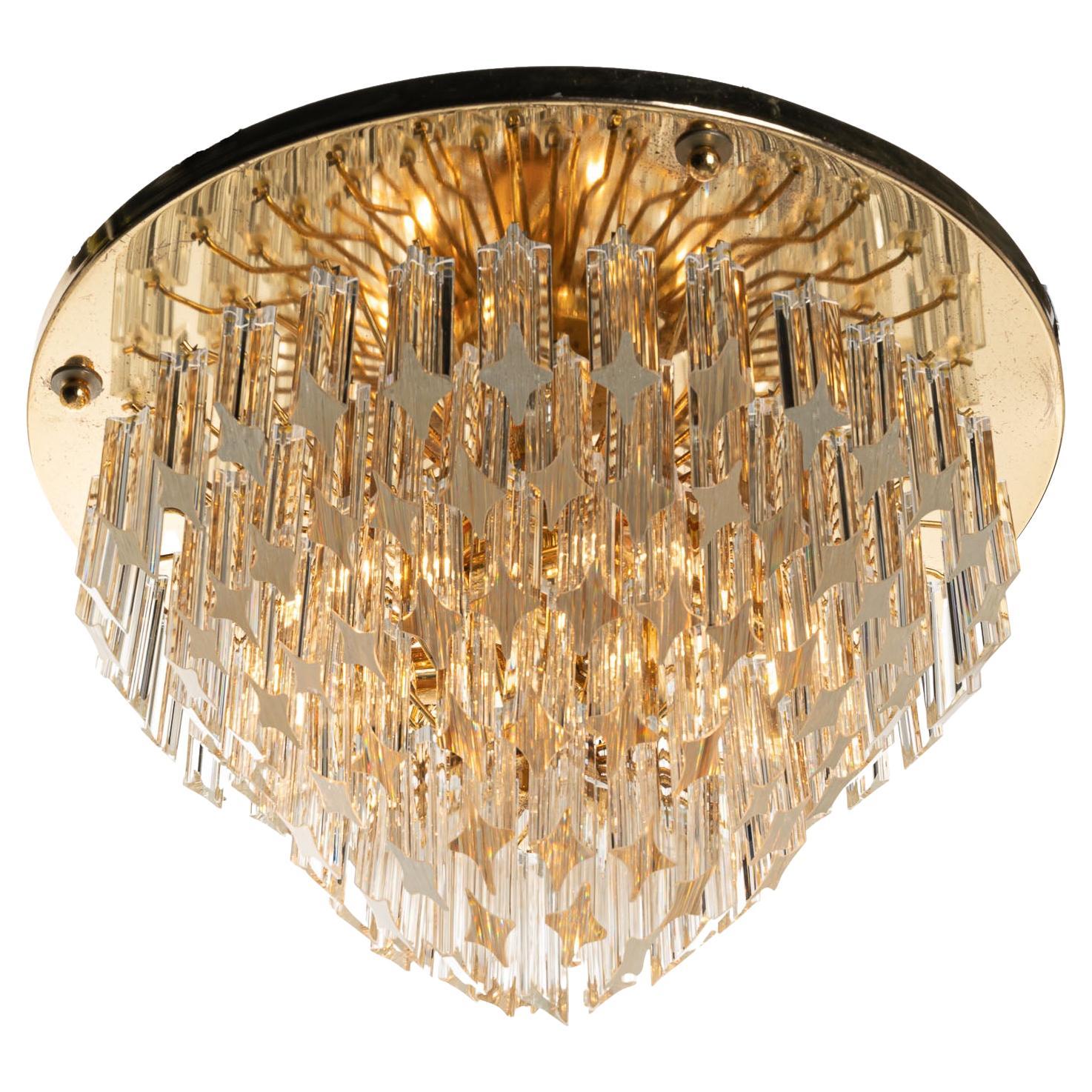 Looking for lighting that makes an impression? This is the one. From round brass plate, underneath we get to a spectacular arrangement of 121 Quadriedri Murano glass bars. This lighting is almost fantasy-like in its appearance, and is guaranteed to