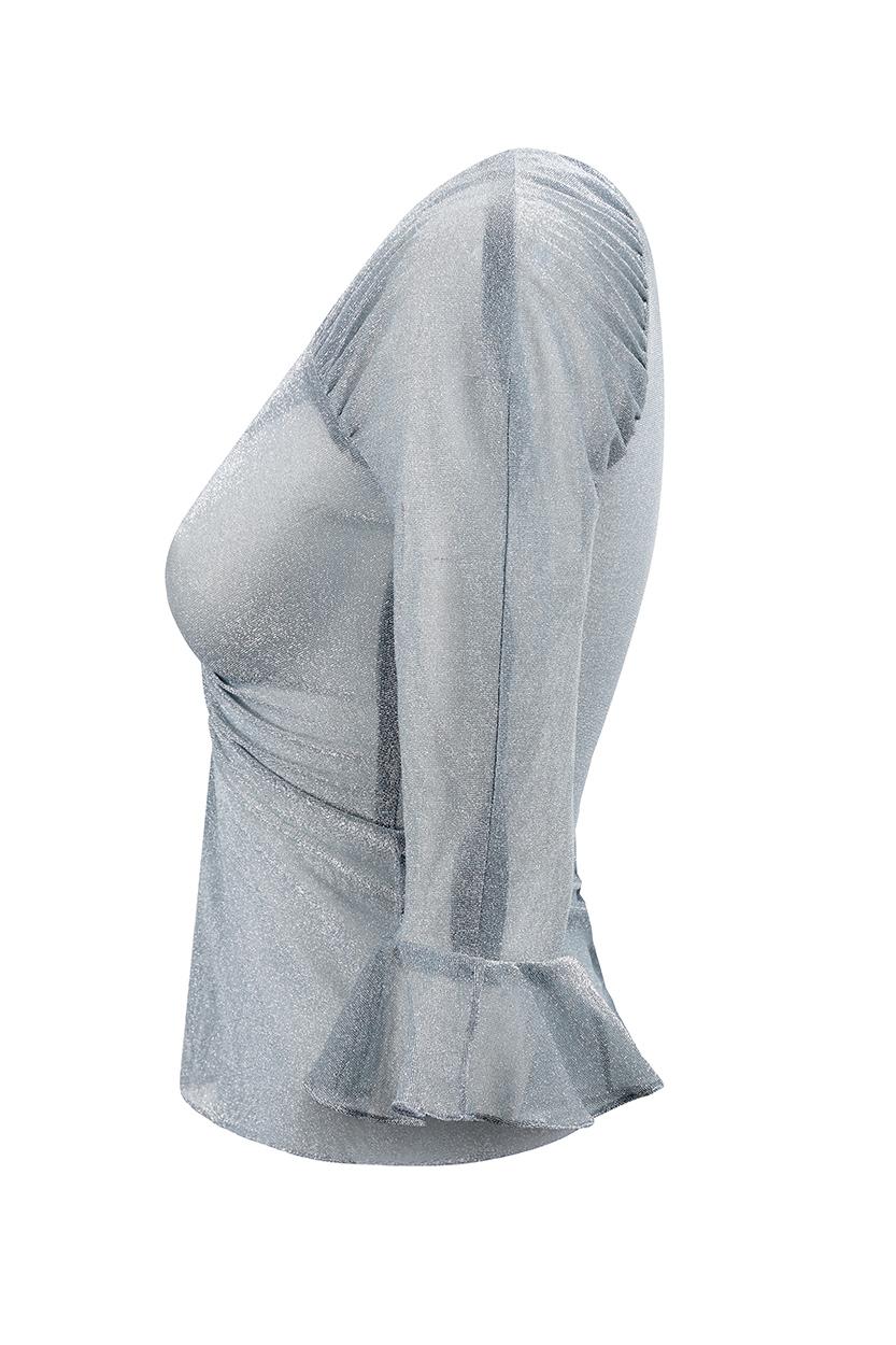 This alluring very early 1970s silver disco top is by celebrated London boutique Quorum, and designed by Marie France, who designed alongside label founder Alice Pollock. The translucent sparkling silvery blue fabric has subtle elasticity and is