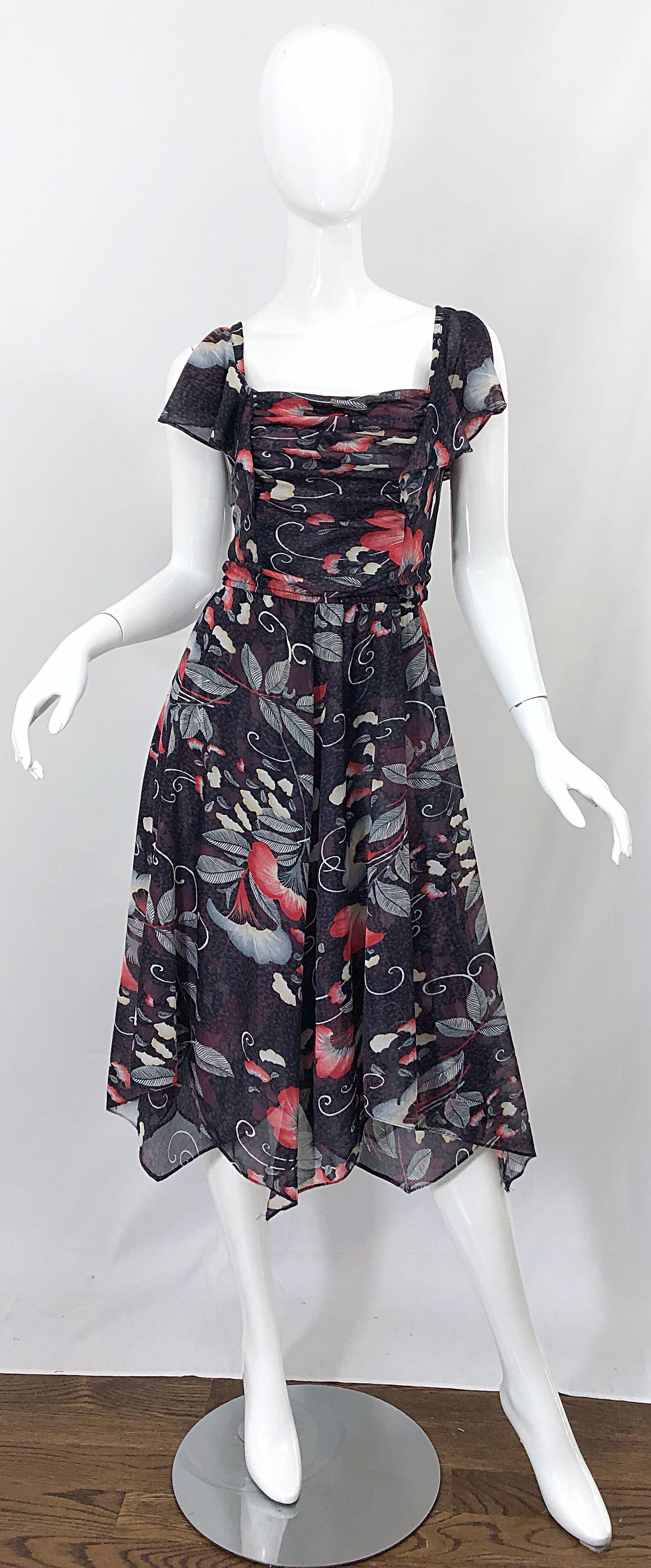Amazing 190s RARE HEPBURN handkerchief hem cold shoulder Asian themed black, red and white dress! Features a flattering ruched bodice with a forgiving flattering skirt that looks great on the dance floor. Cold shoulders reveal just the right amount